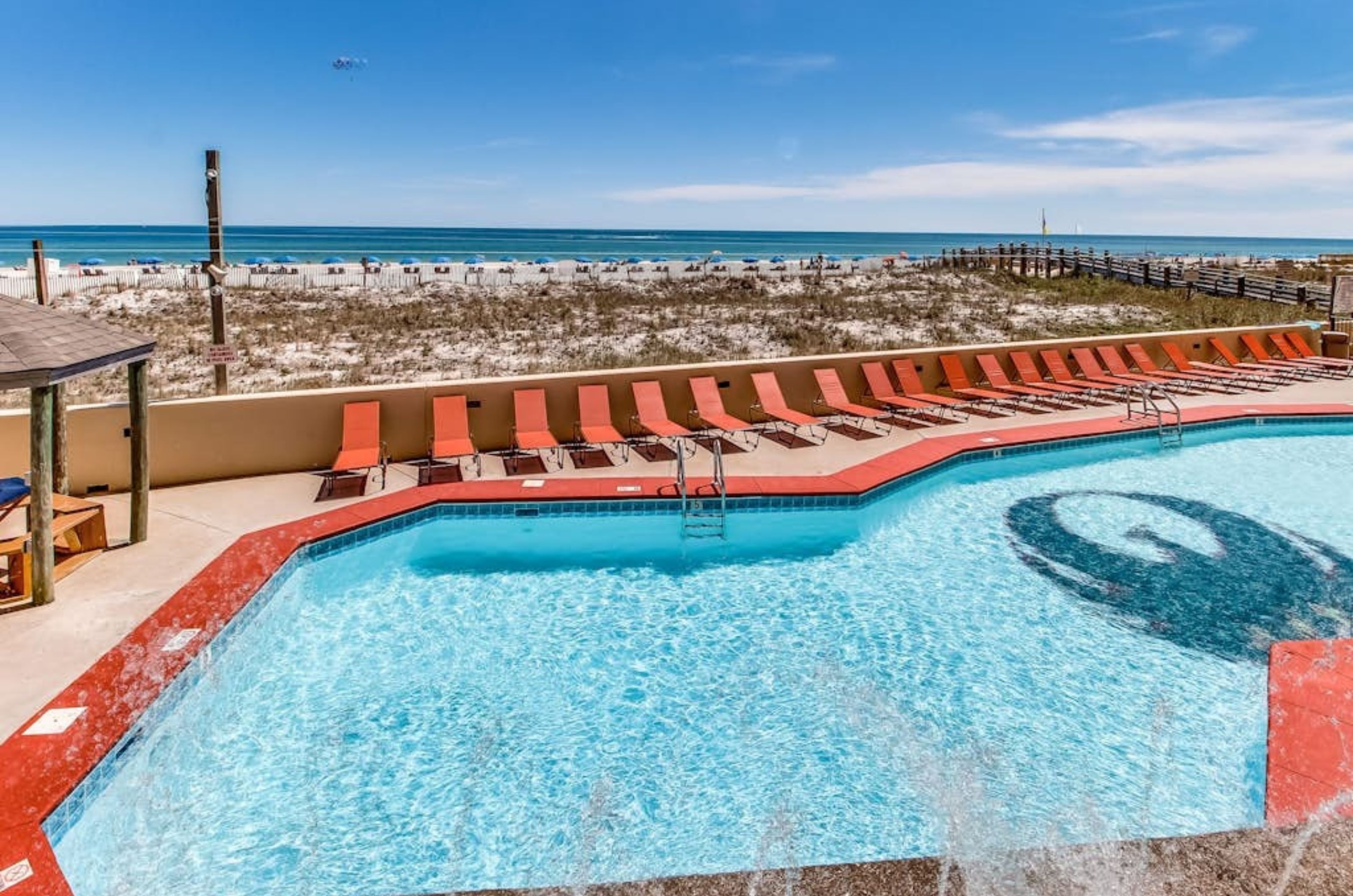 The outdoor pool and pool deck with lounge chairs at Phoenix III