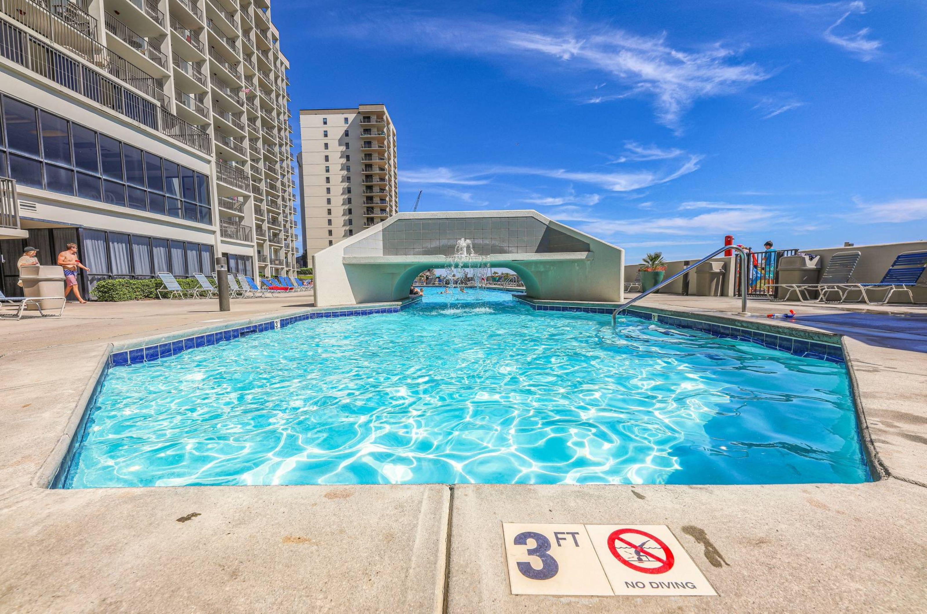 The outdoor swimming pool at Phoenix VI in Orange Beach Alabama 