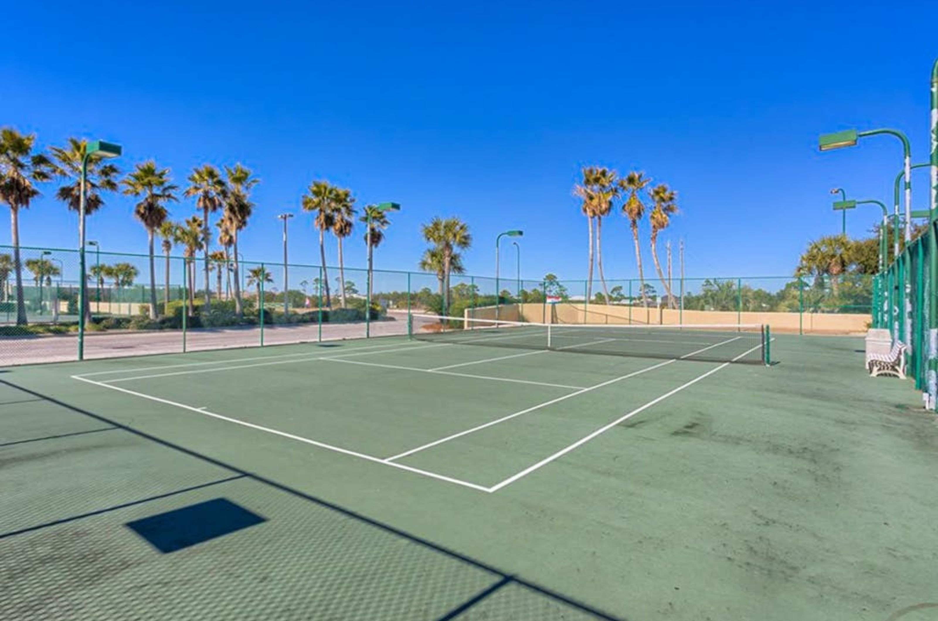 The outdoor tennis courts at Phoenix VII in Orange Beach Alabama 