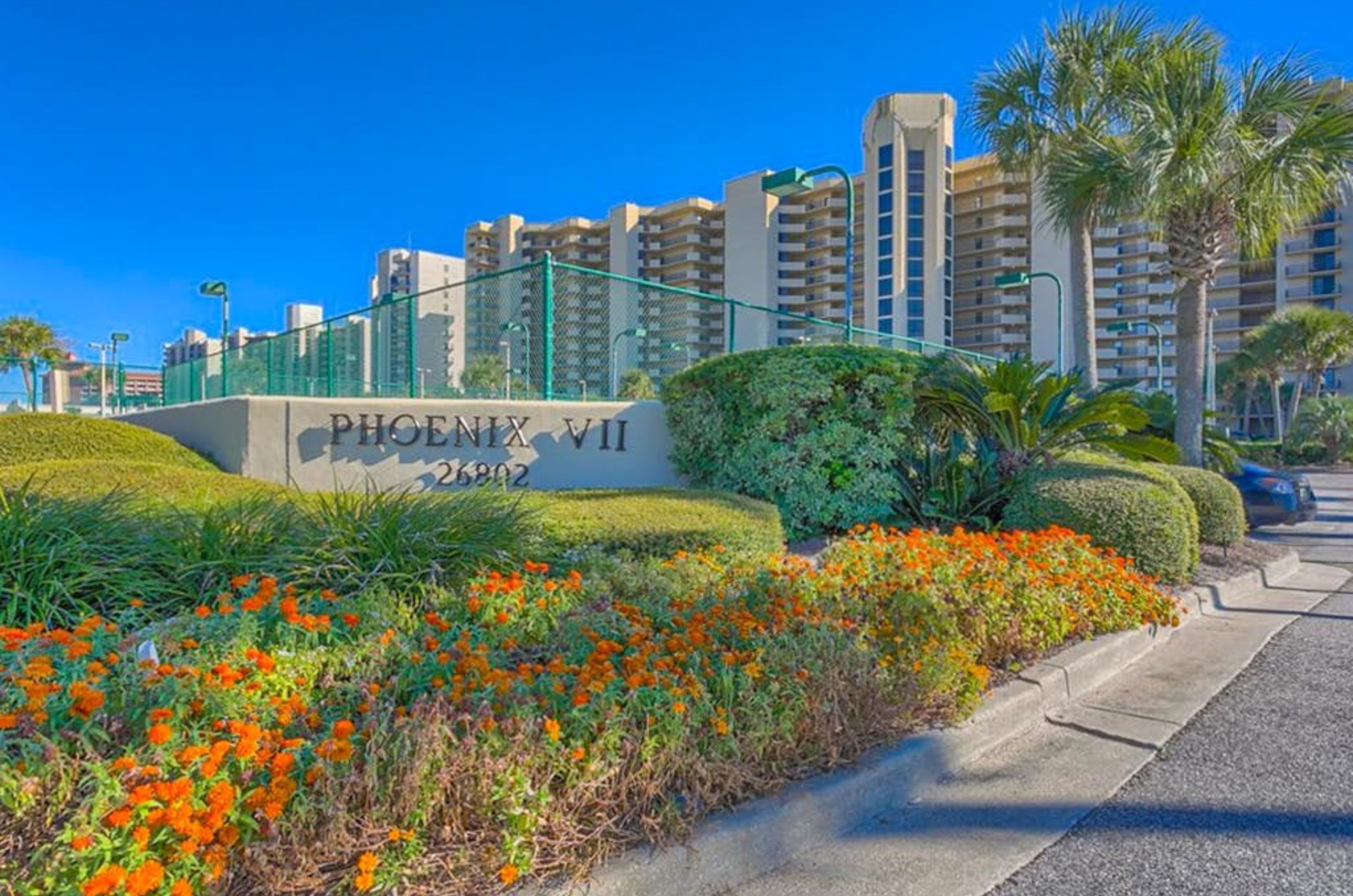 View from the street of the Phoenix VII and the property's entry sign