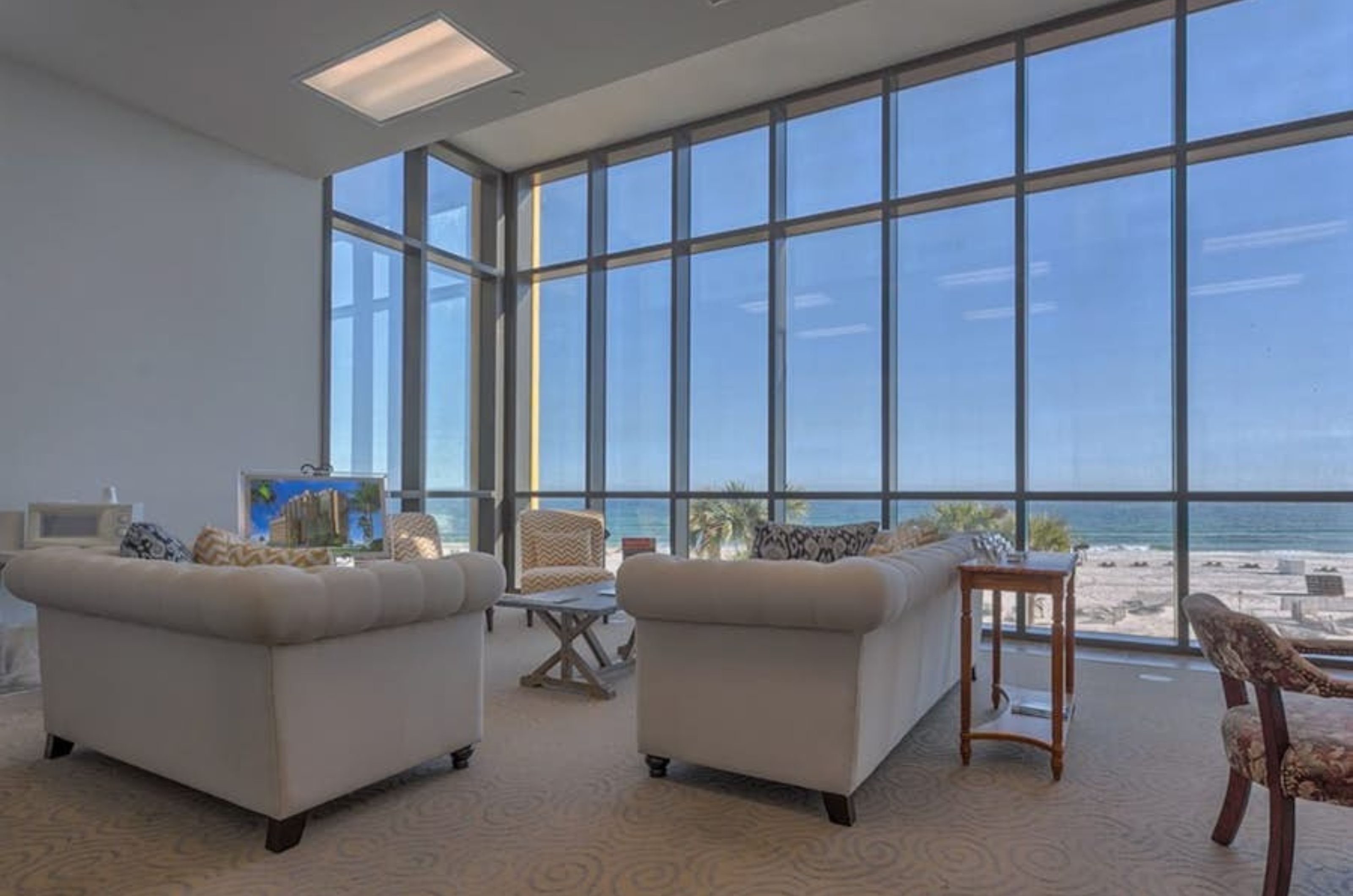 Chairs and floor to ceiling windows in the lobby at Phoenix West II