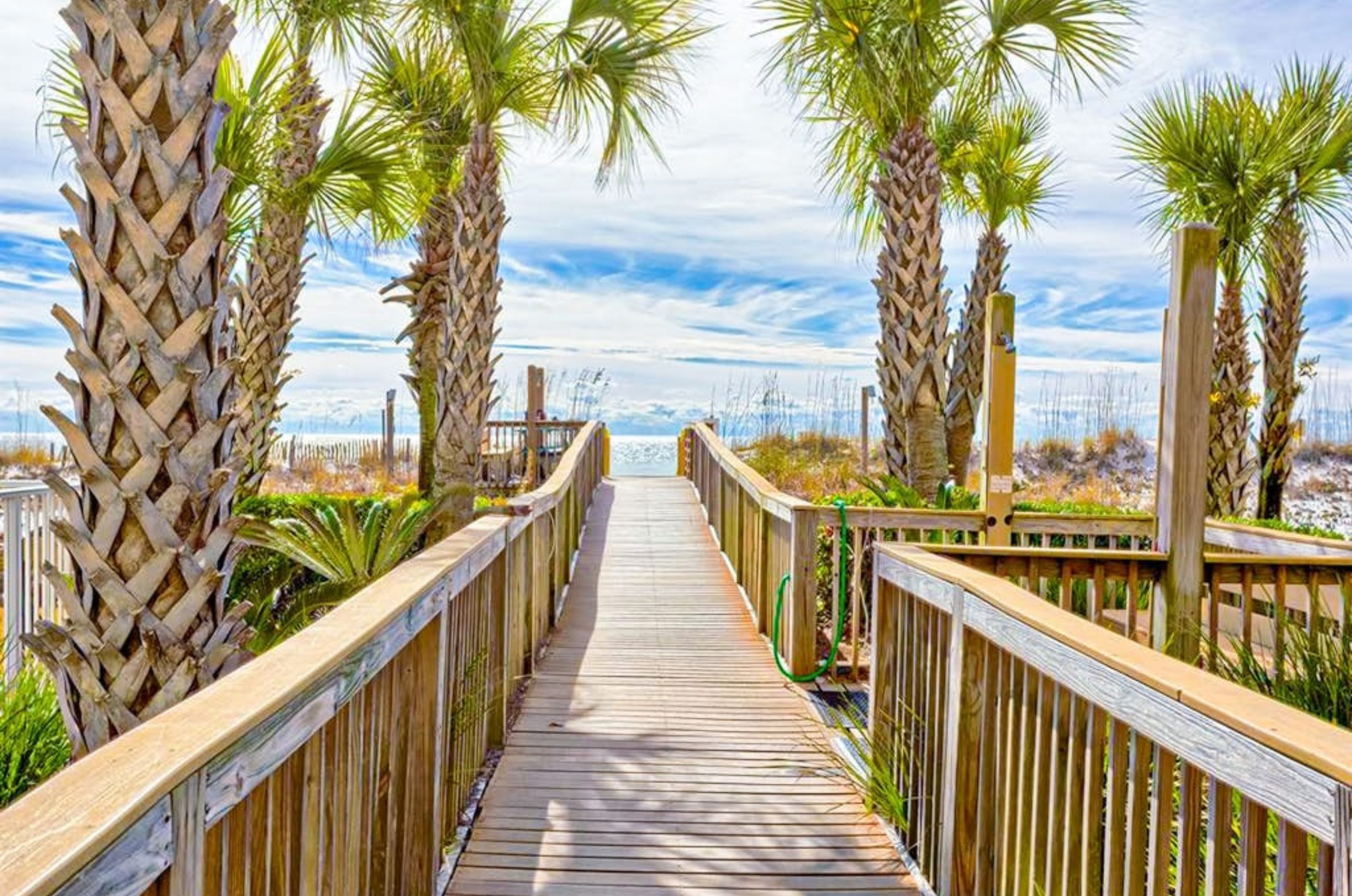 A wooden walkway leading to the Gulf at Regency Isle Condominiums in Orange Beach Alabama