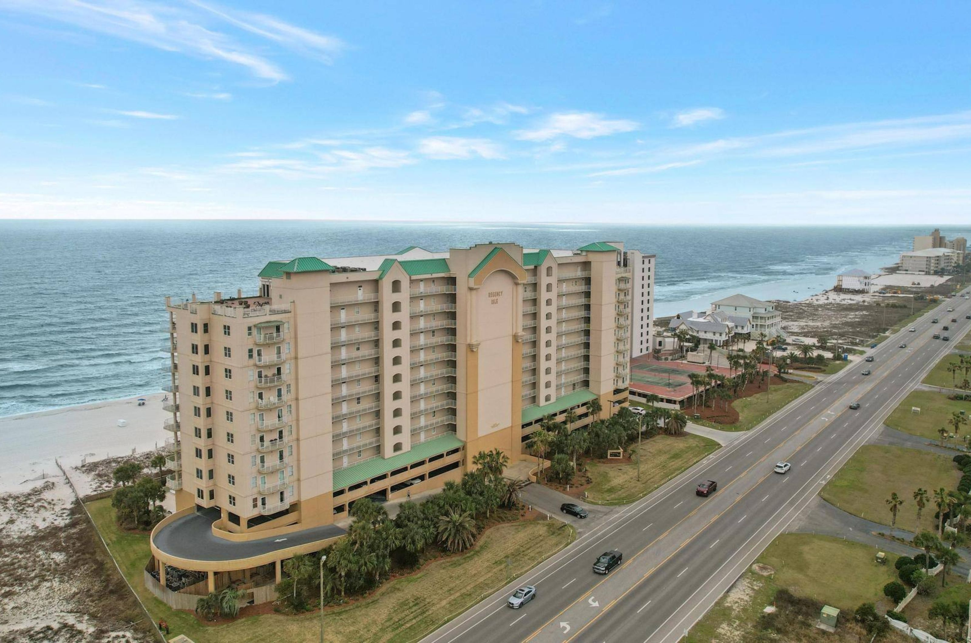 Aerial view of the streetside exterior of Regency Isle in Orange Beach Alabama 