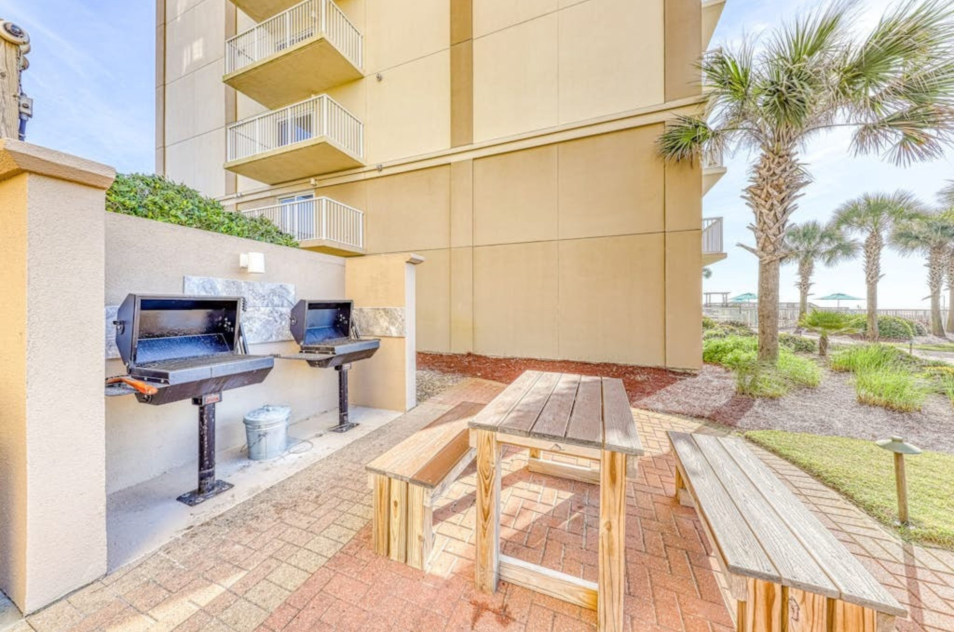 The picnic area with four stainless steel grills and tables at Sandy Key 