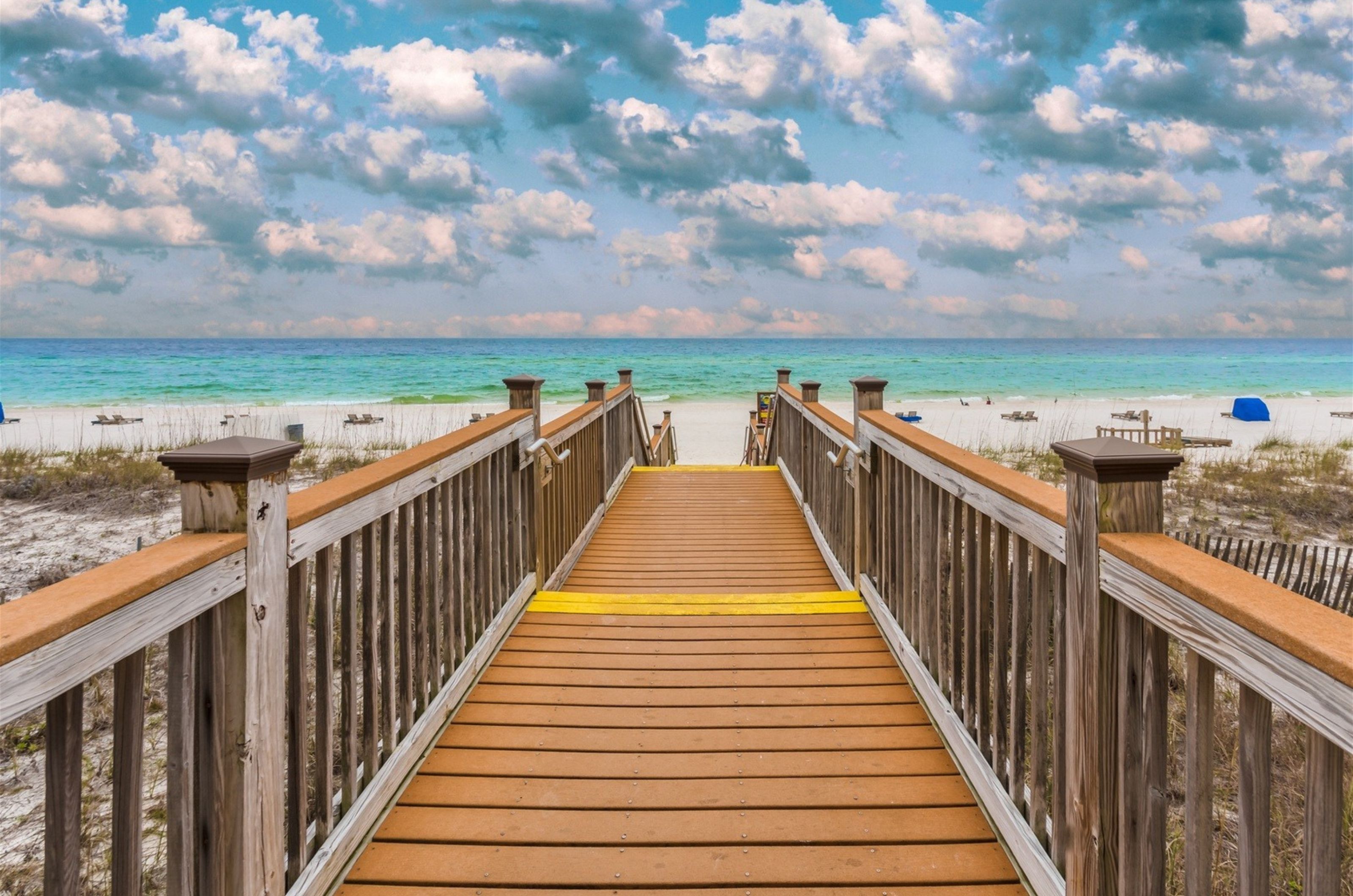 The wooden boardwalk leading to the Gulf of Mexico at Sandy Key Condominiums 