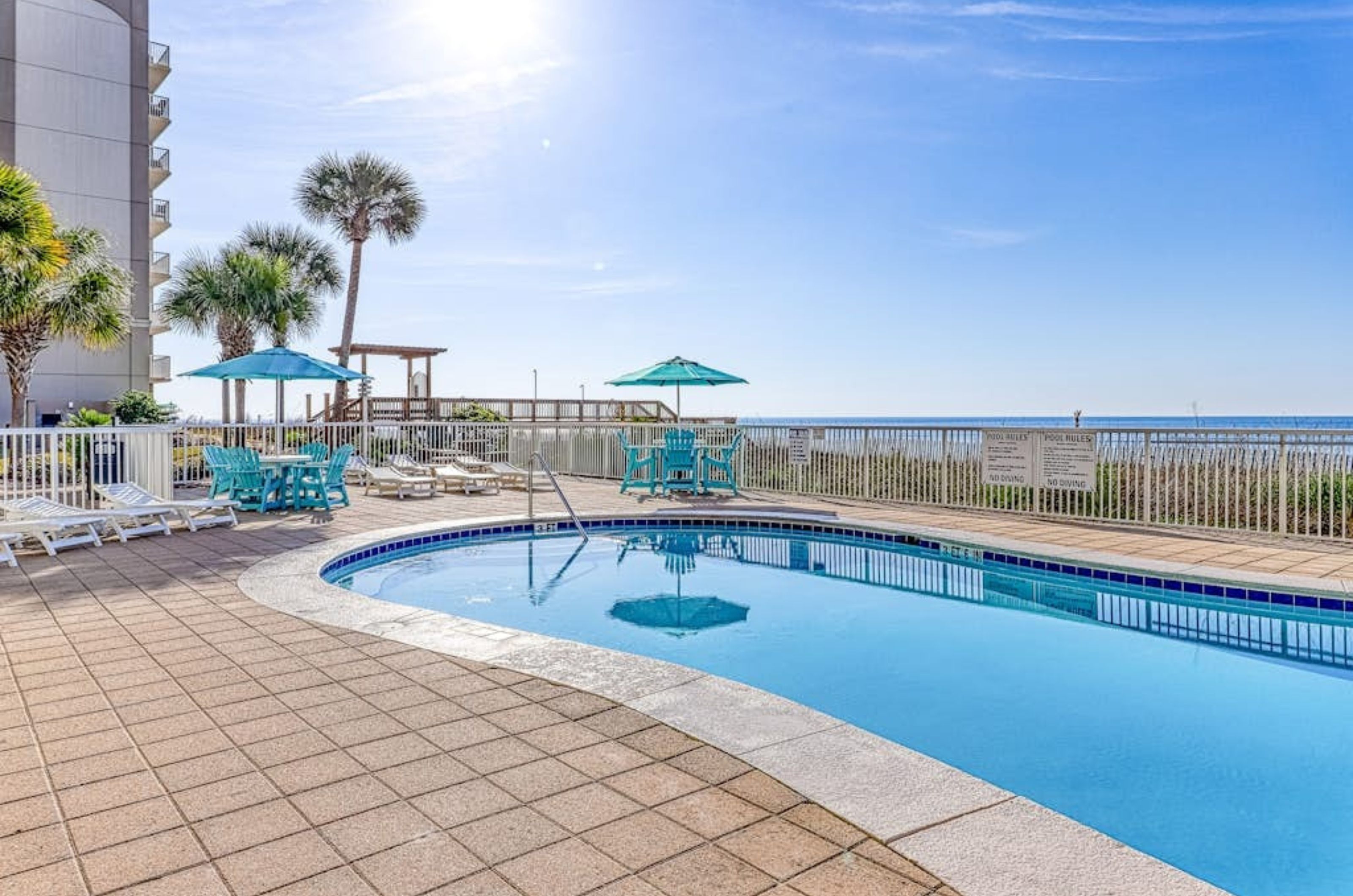 The beachside swimming pool at Sandy Key Condominiums