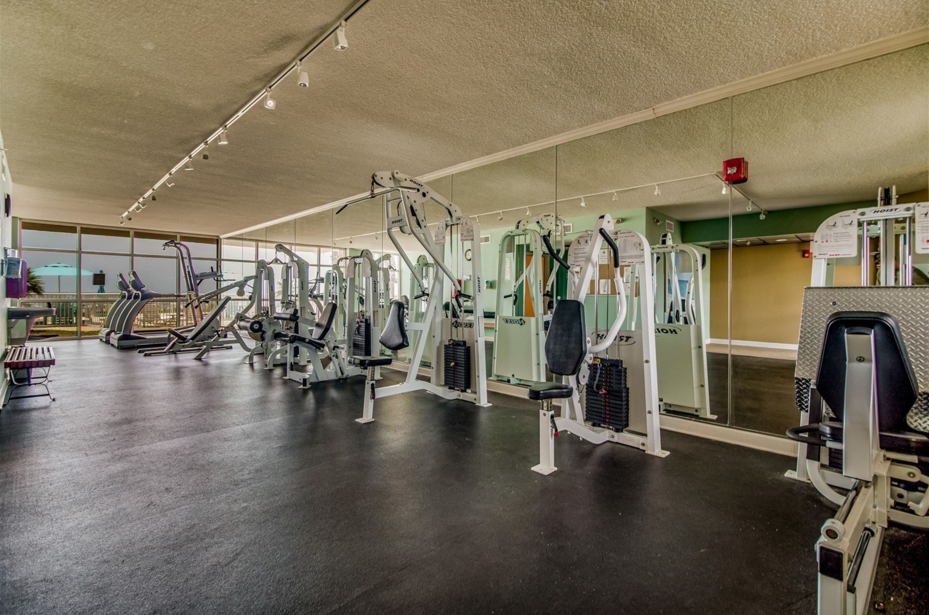 The on-site fitness center with cardio and strength equpiment at Sandy Key in Perdido Key Florida 