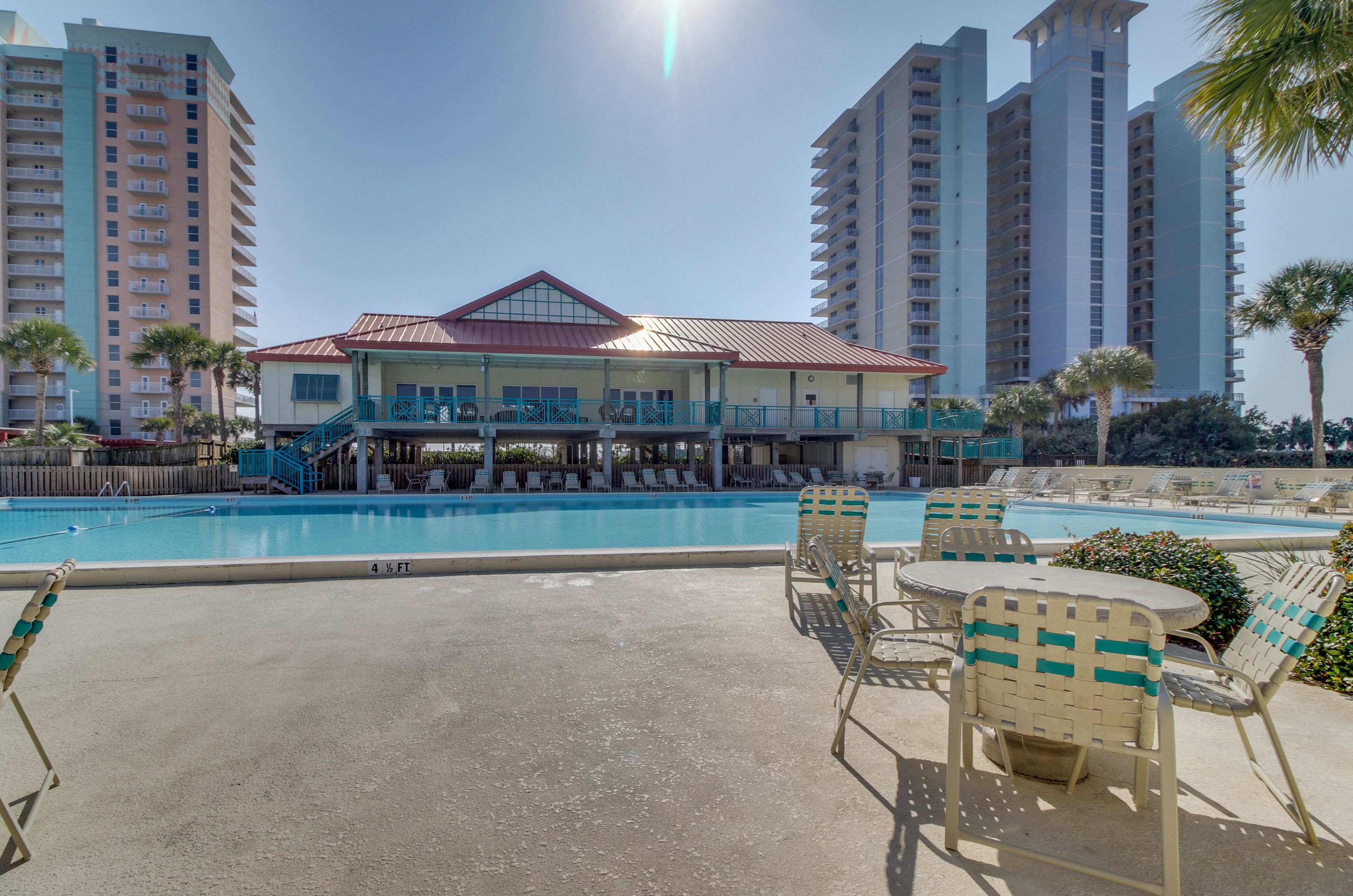 The olympic-sized outdoor swimming pool in front of the clubhouse at Santa Rosa Dunes 