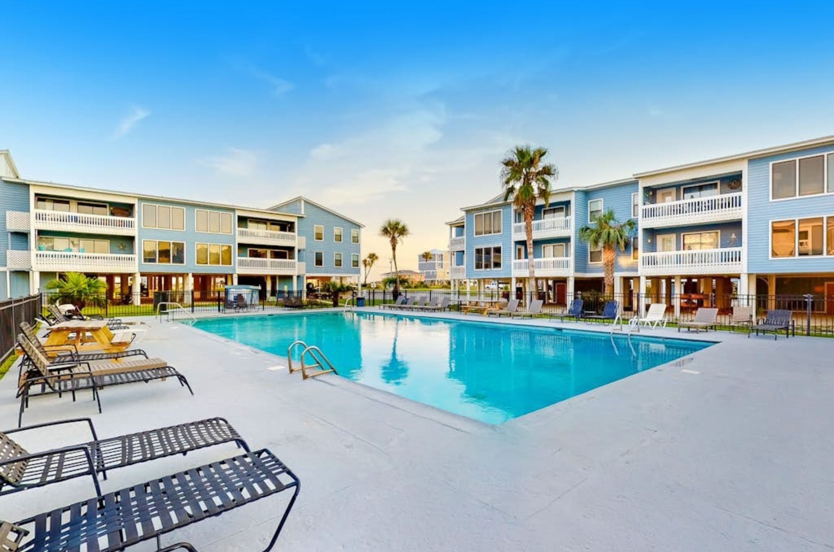 An outdoor swimming pool in front of Sea Oats Condominiums in Gulf Shores Alabama 