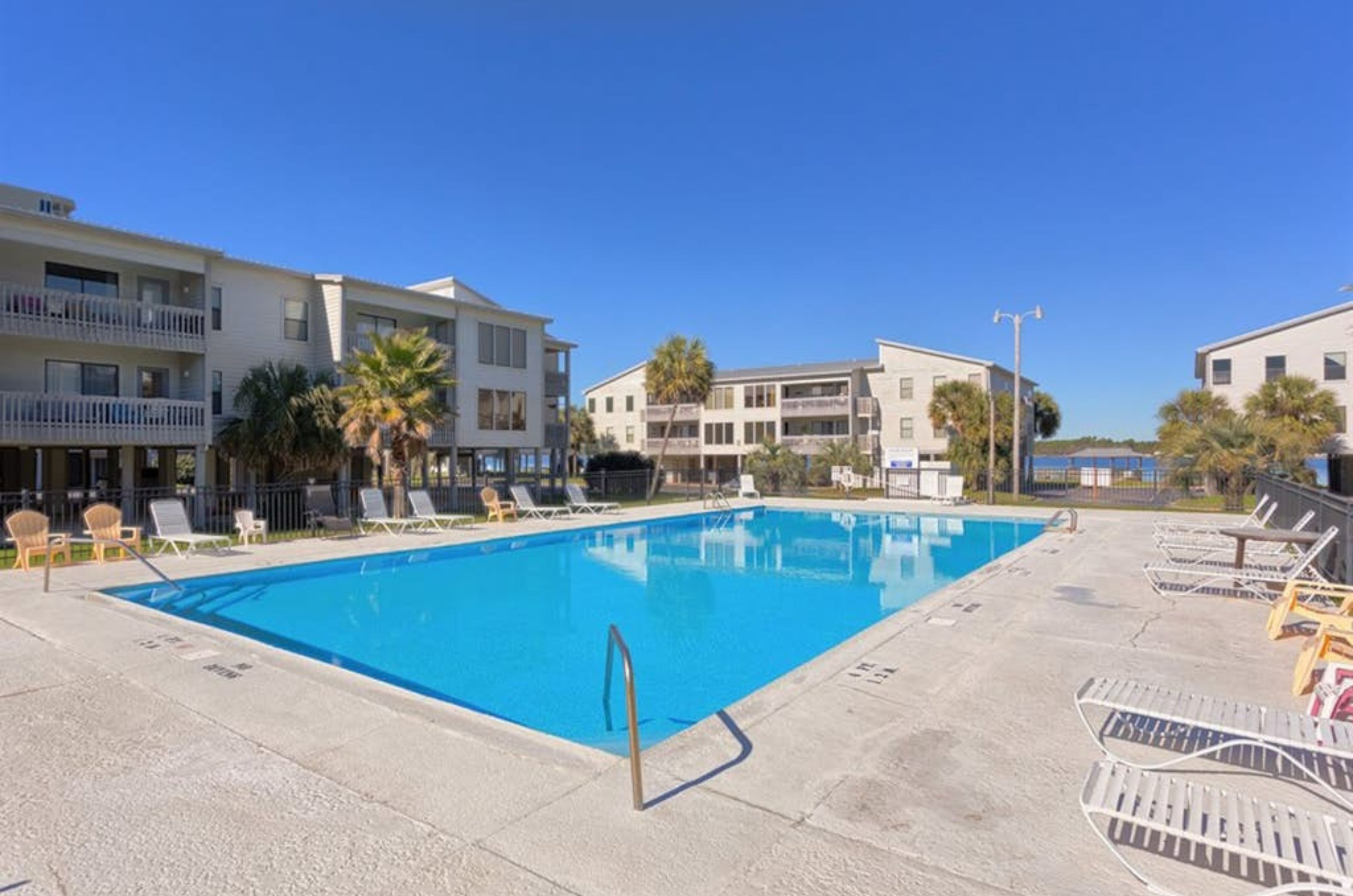 The pool and pool deck with lounge chairs at Sea Oats in Gulf Shores Alabama 