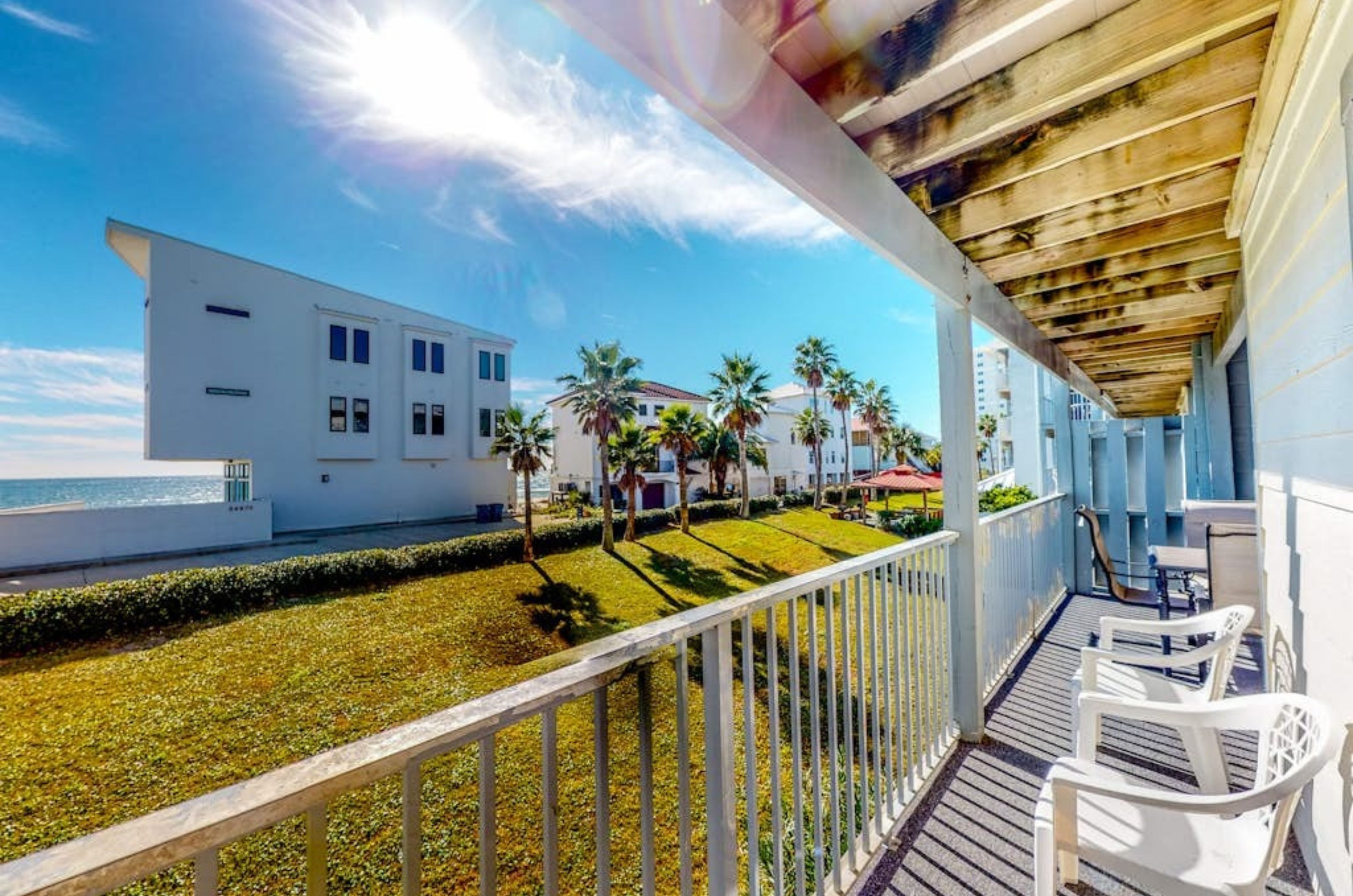 A private balcony with chairs at Seascape in Orange Beach Alabama 