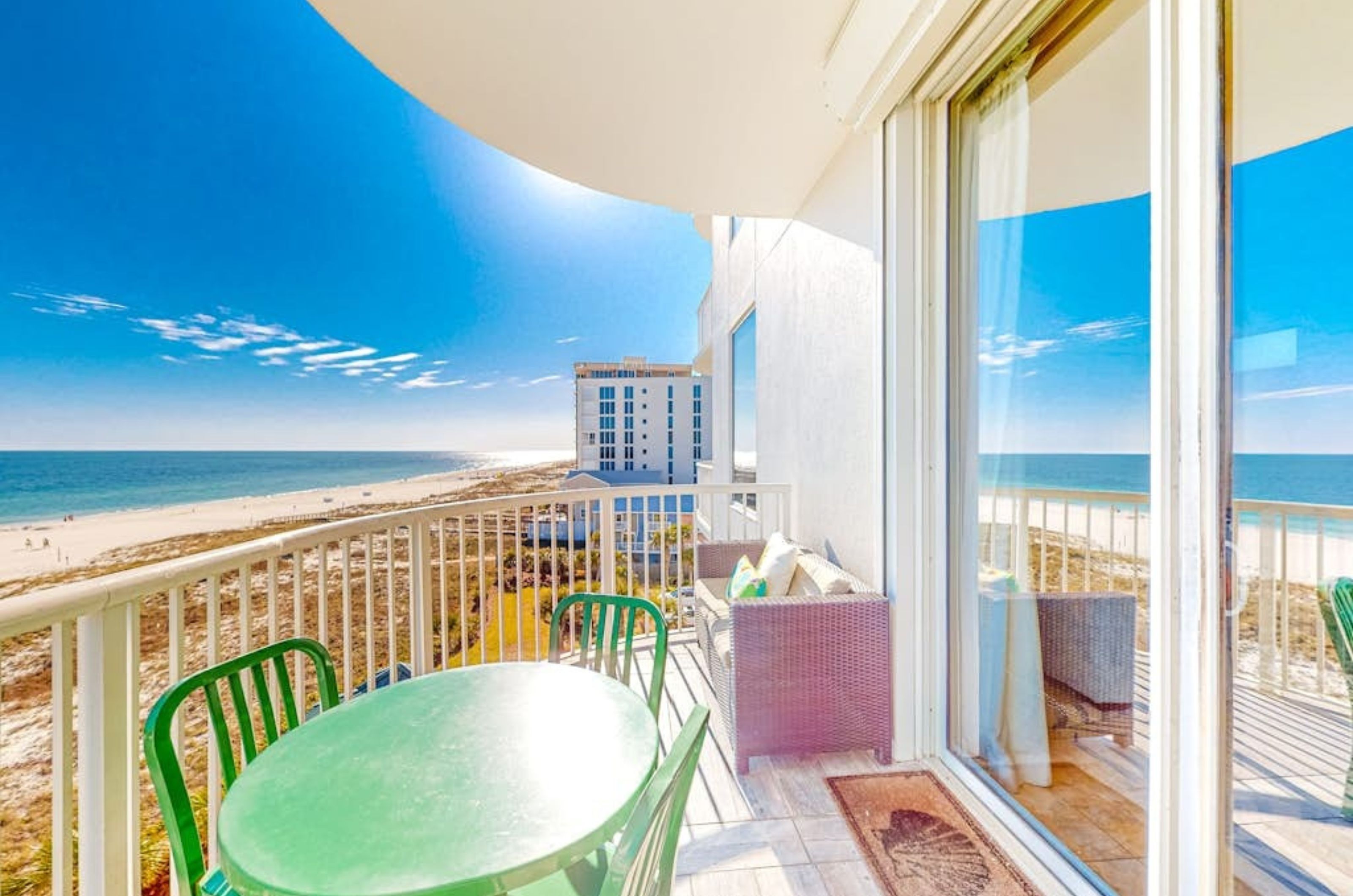 A private balcony with chairs and tables overlooking the Gulf of Mexico at Spanish Key Condos in Perdido Key Florida 