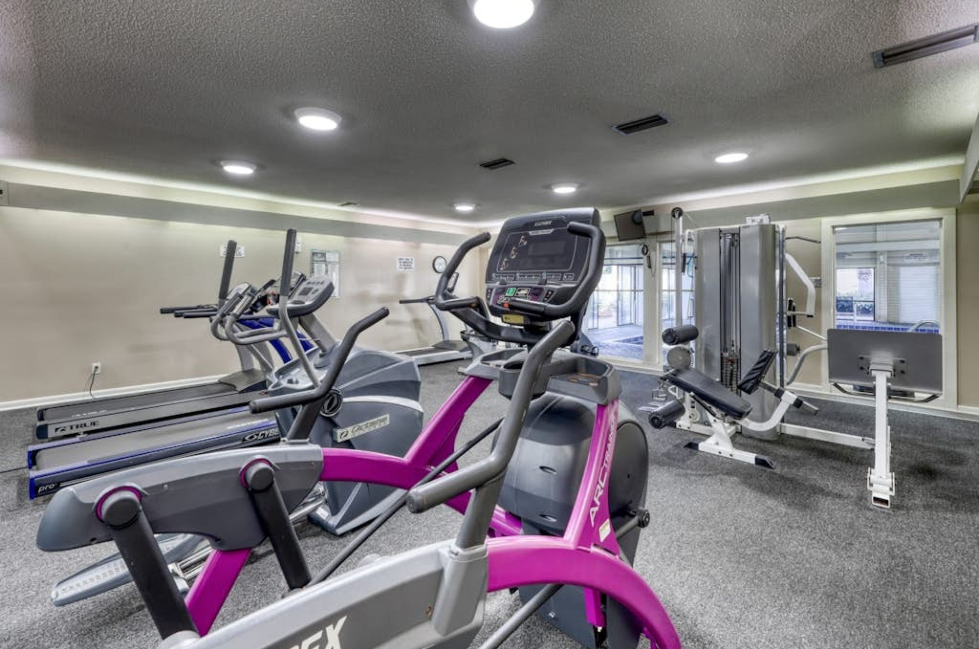 Strength and cardio equipment in the gym at Summer House on Romar Beach 