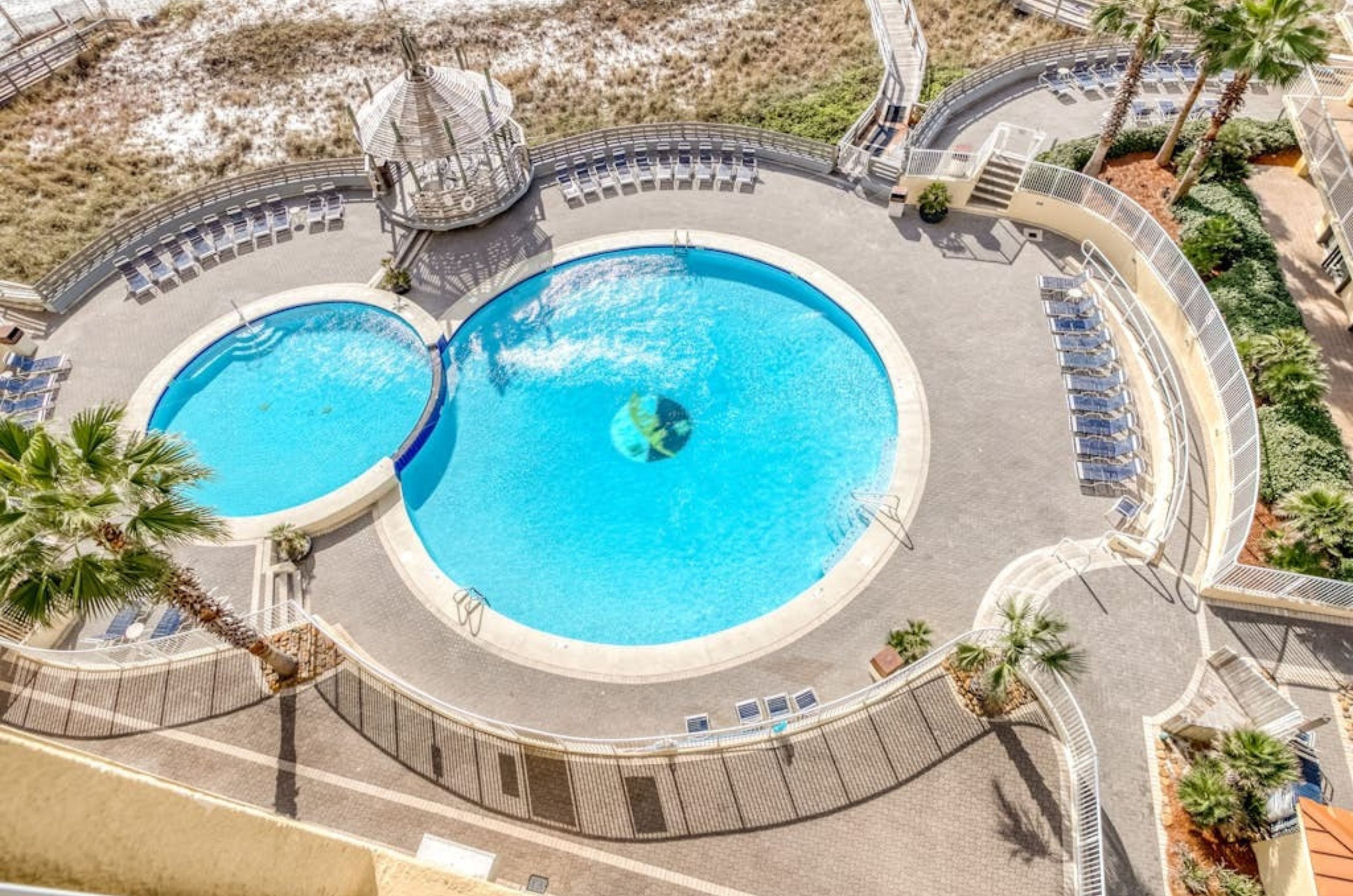 Overhead view of the large swimming pools at Summer House on Romar Beach