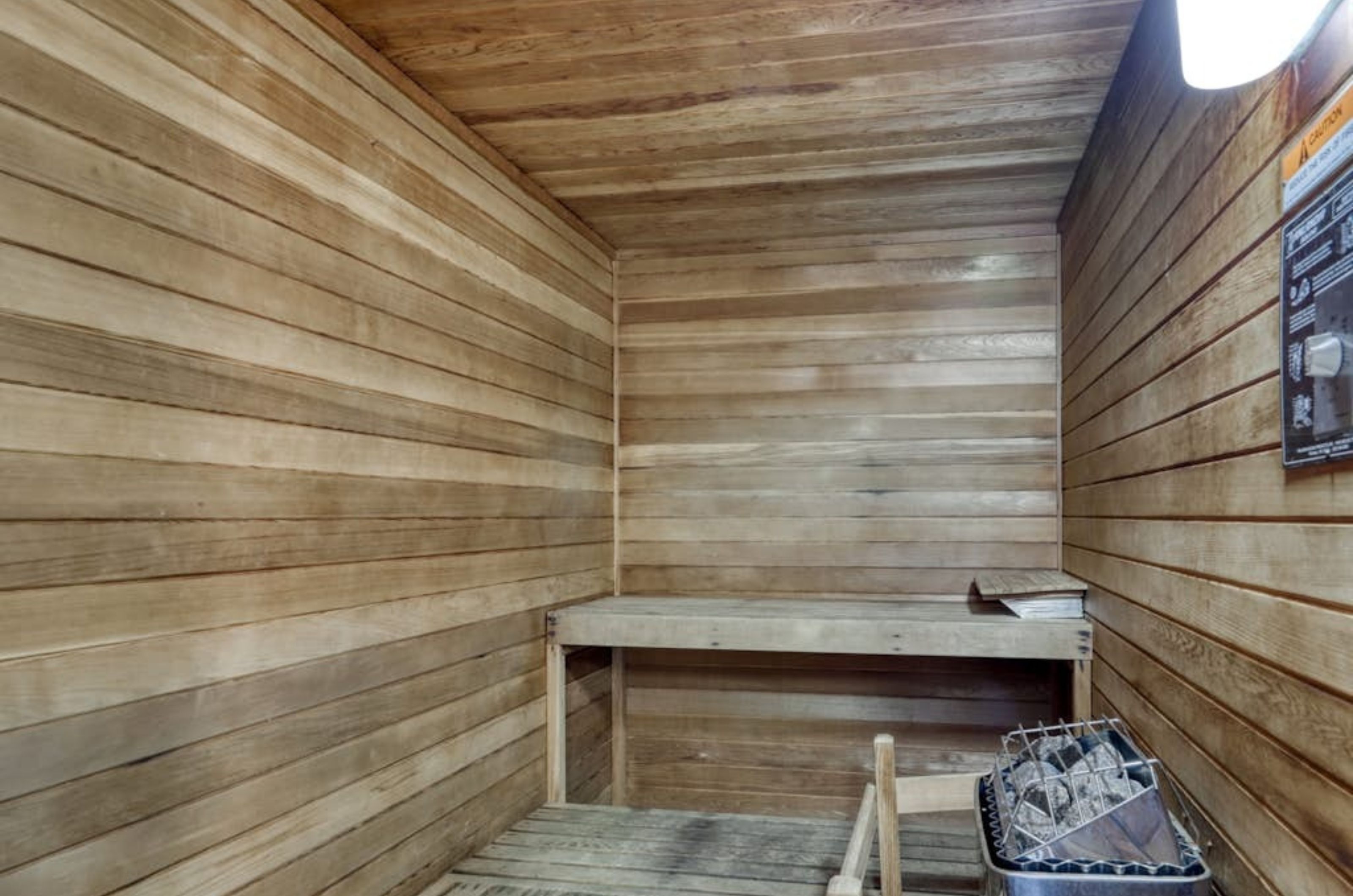 The wooden indoor of the sauna at Summerchase Condominiums 