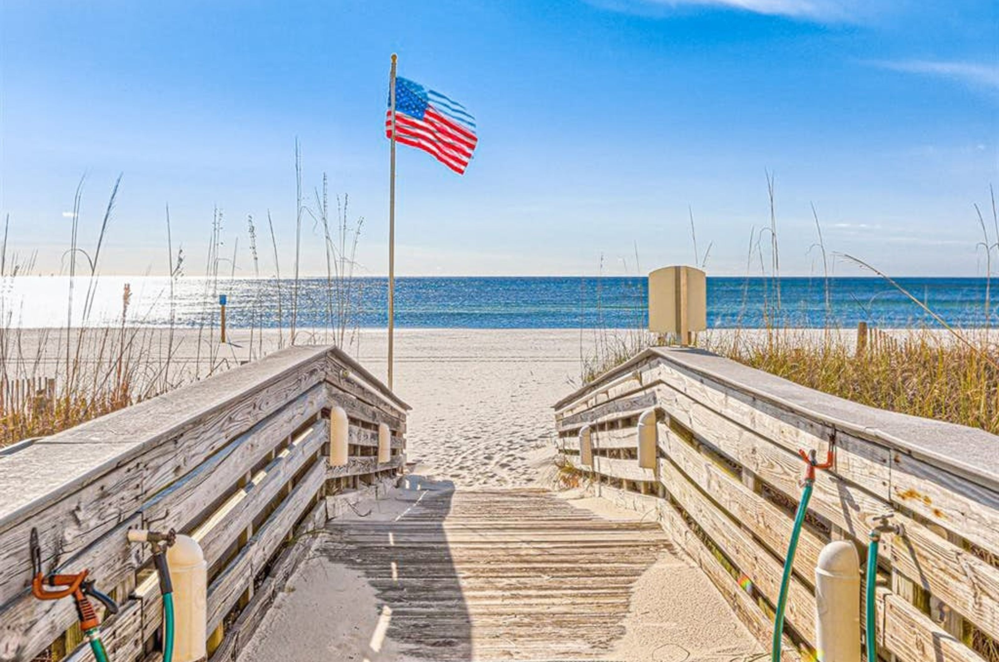 A wooden boardwalk leading to the Gulf