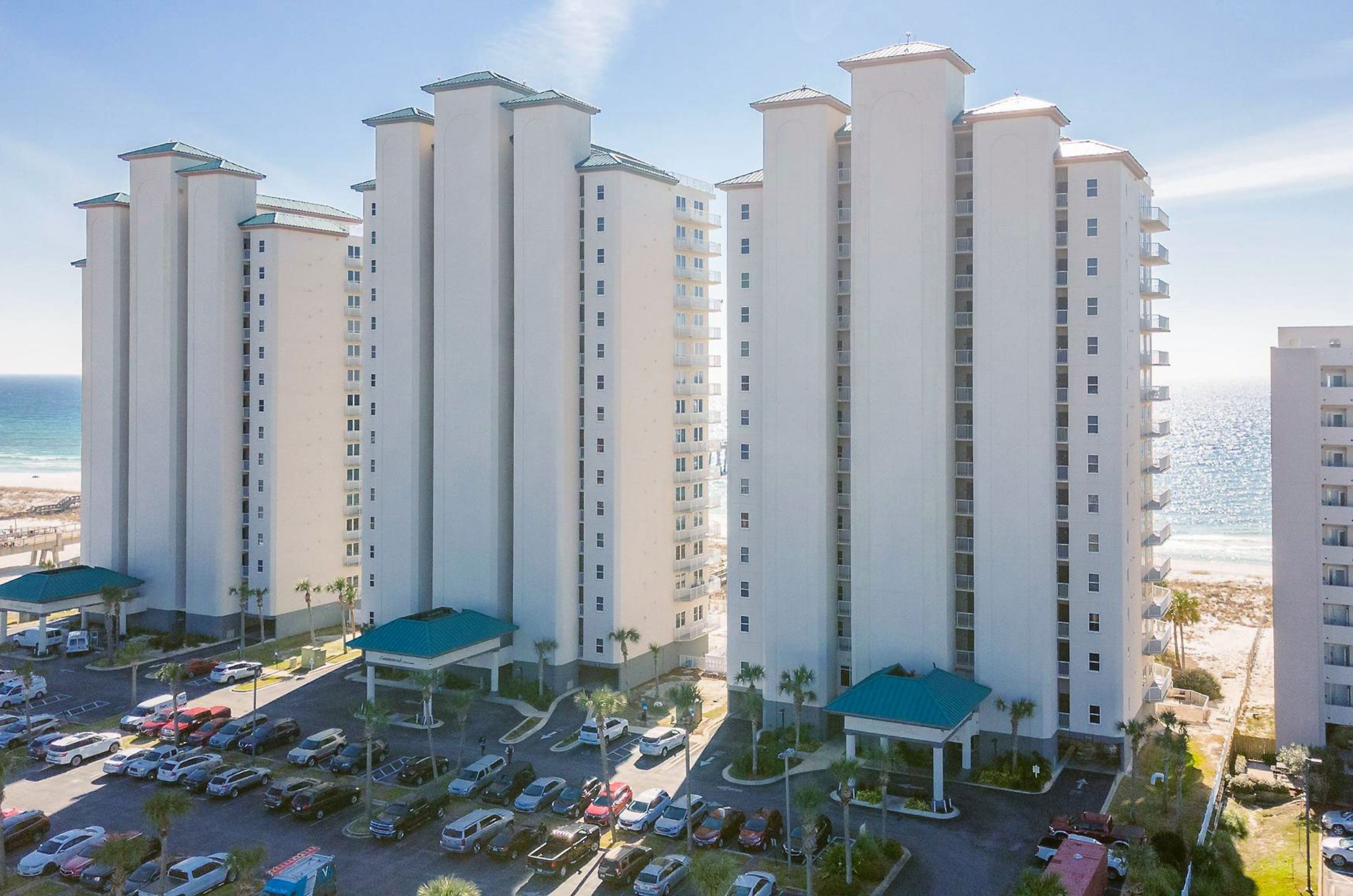 Aerial view of the street-side exterior of Beach Colony Resort