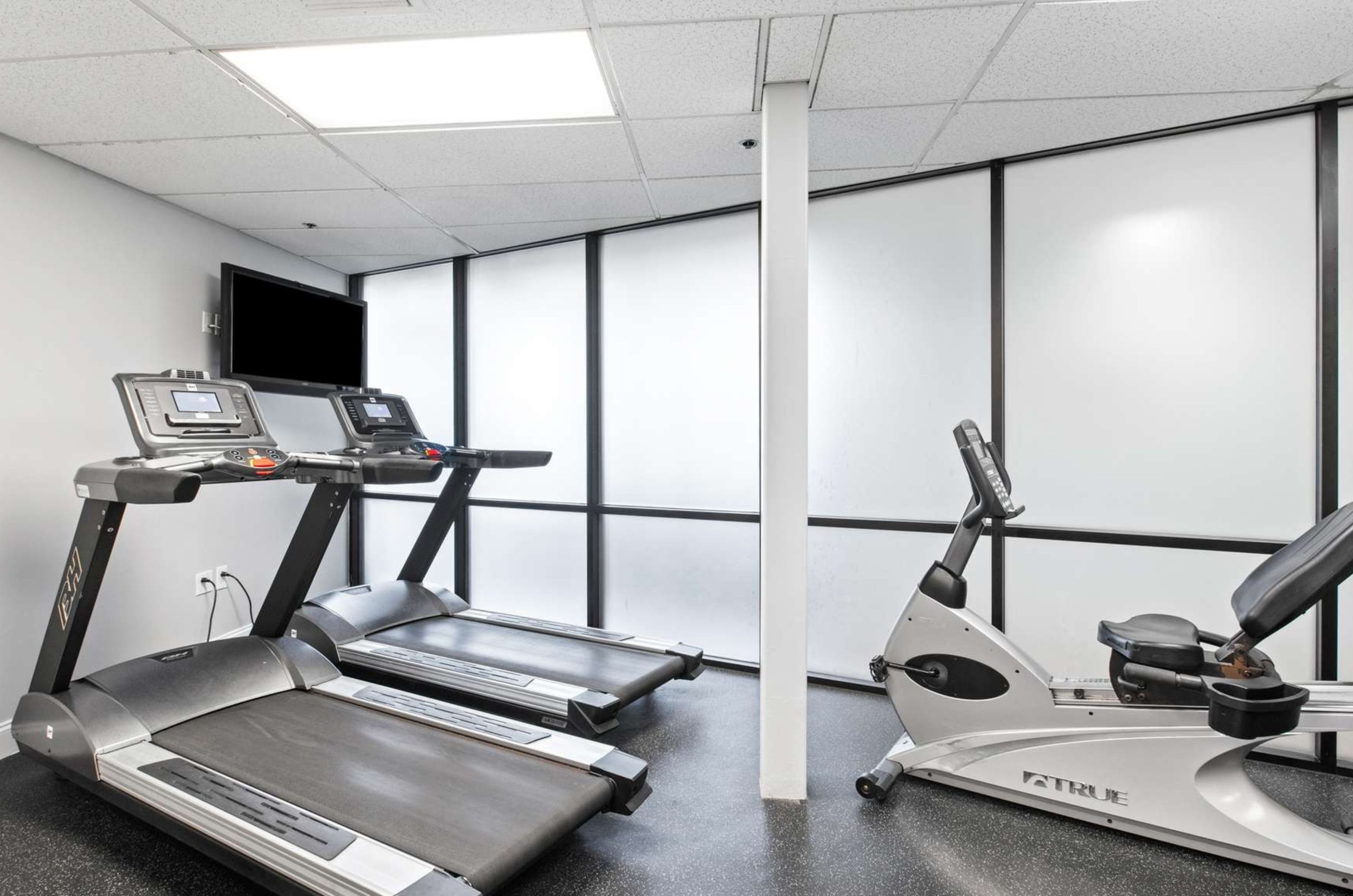 The treadmills and a stationary bike in the gym at SunDestin Beach Resort 