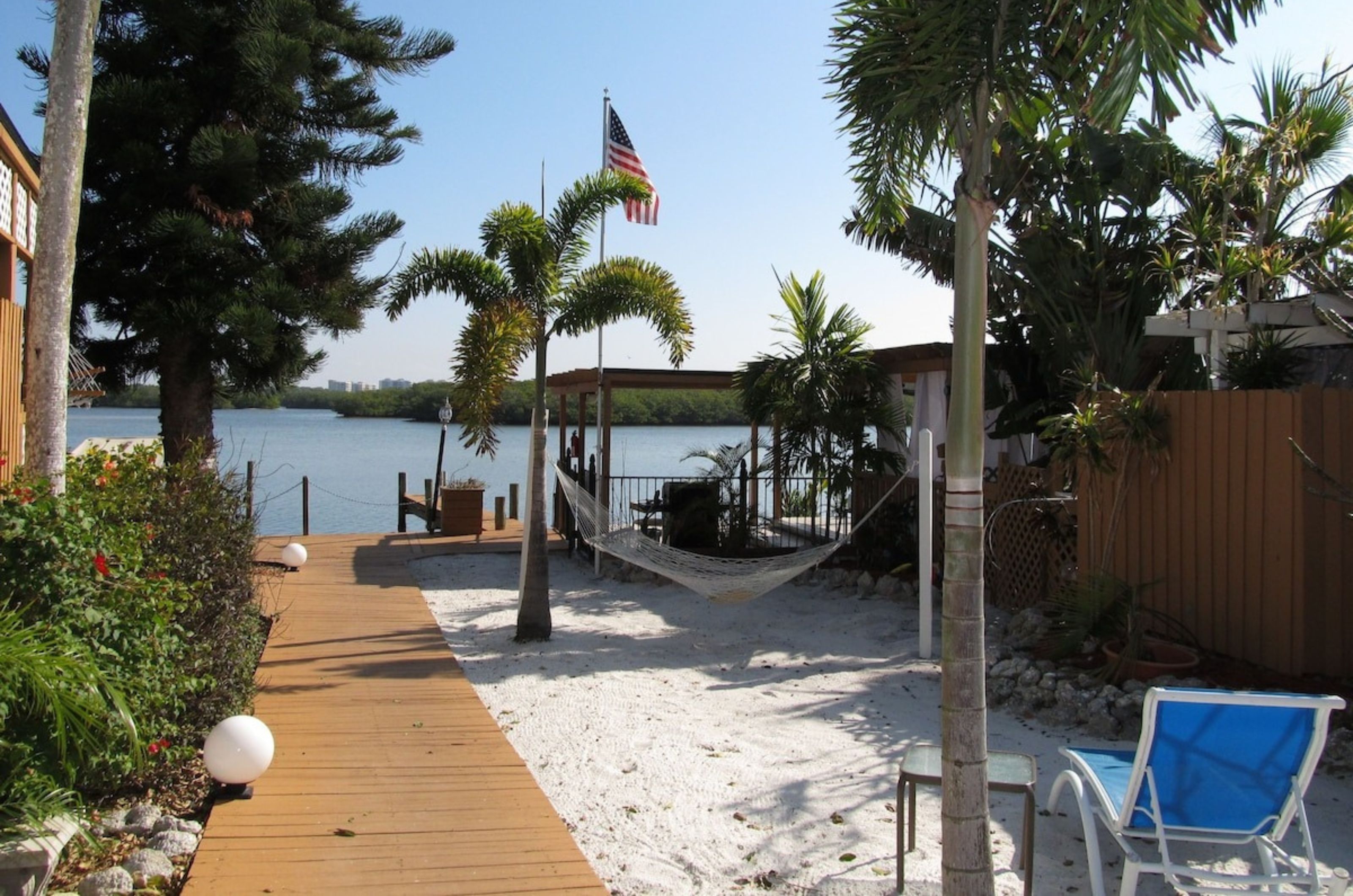 The hammock and lounge chair next to the water at the Inn at Turtle Beach in Siesta Key Florida 