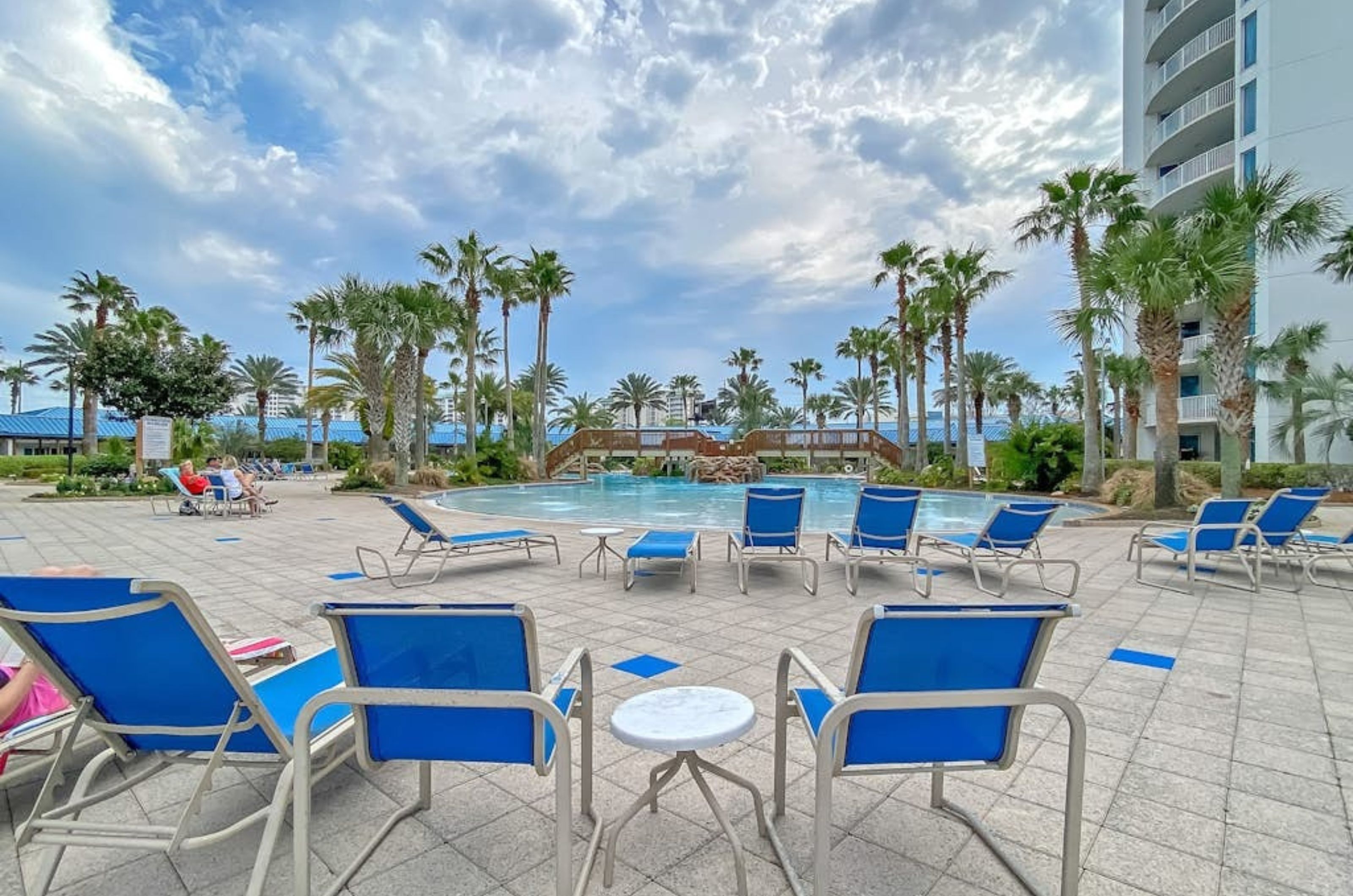 Lounge chairs next to the outdoor pool at the Palms of Destin 