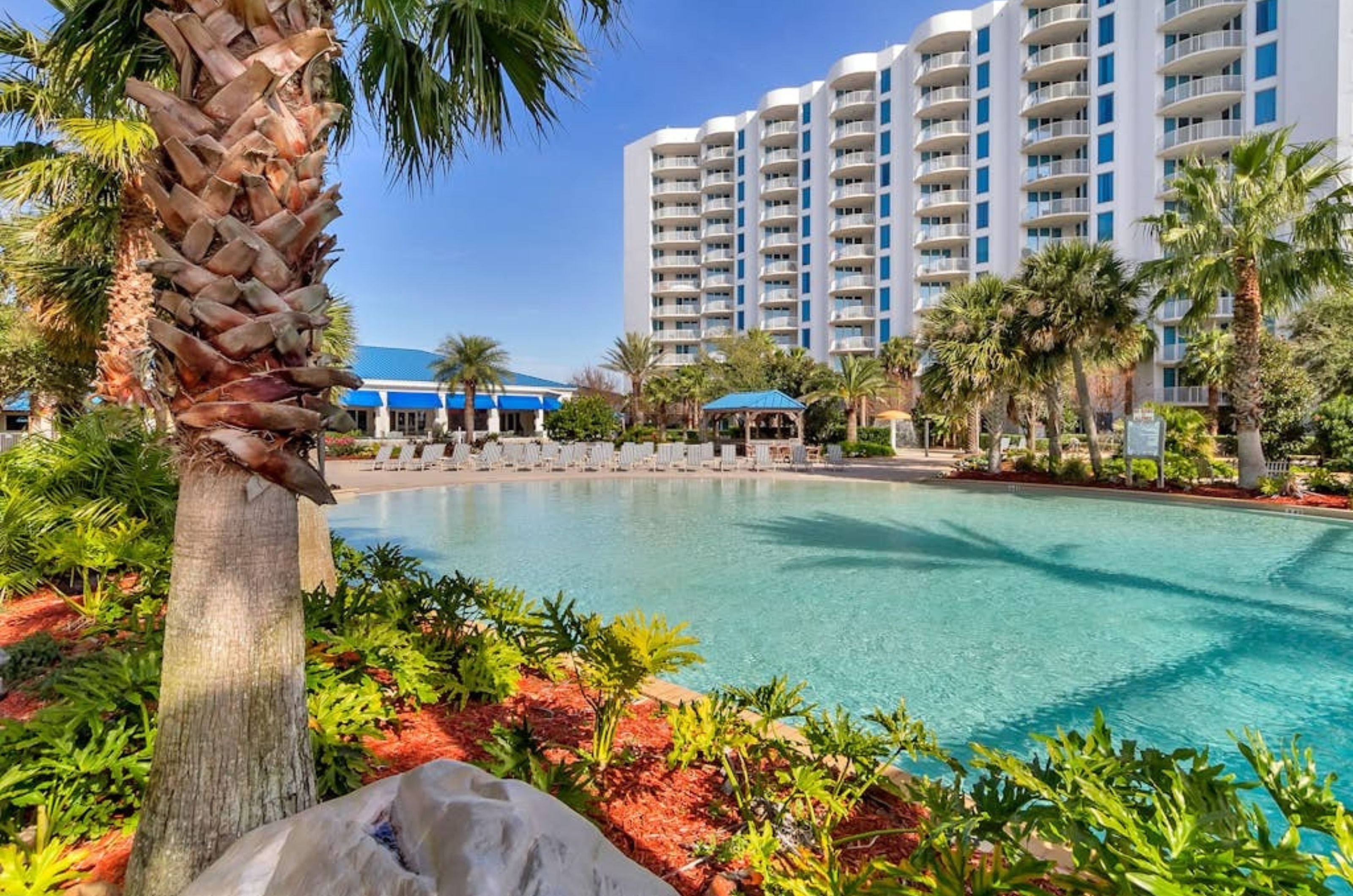 The tropical landscaping around the pool at the Palms of Destin in Destin Florida 