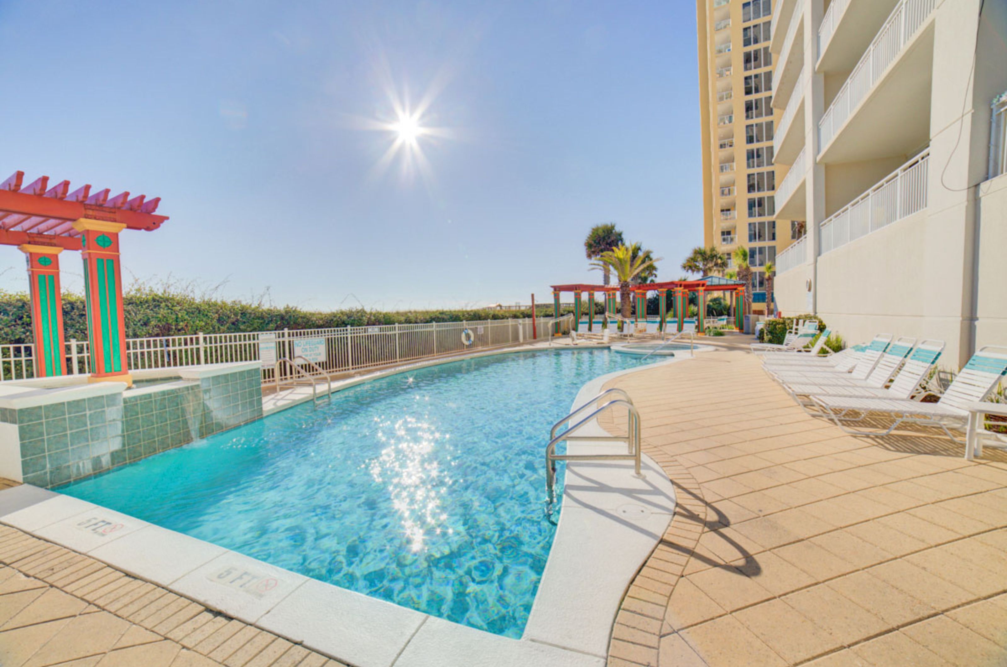 The beachfront outdoor swimming pool next to the resort 