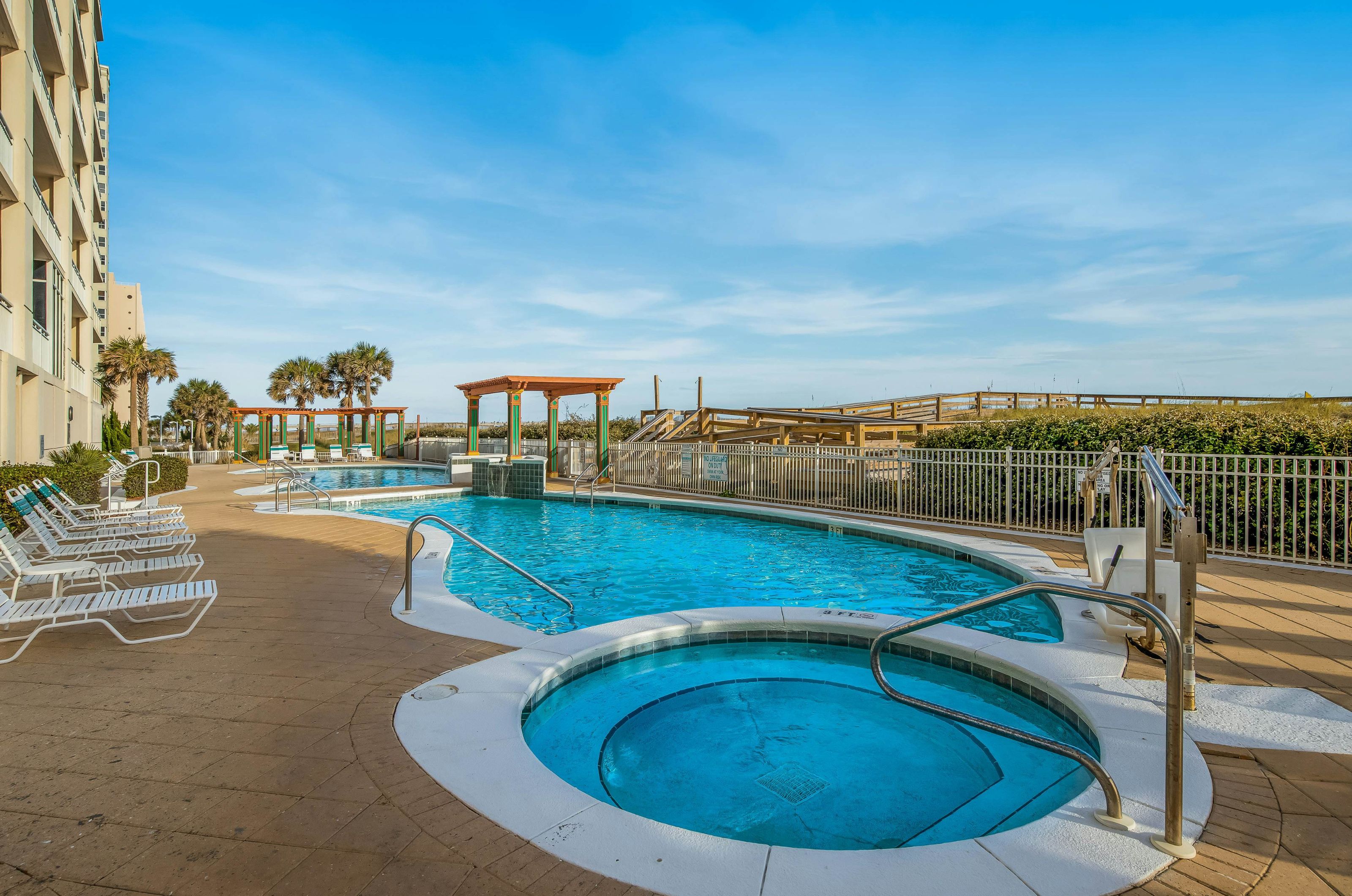 Outdoor hot tub and swimming pool overlooking the Gulf