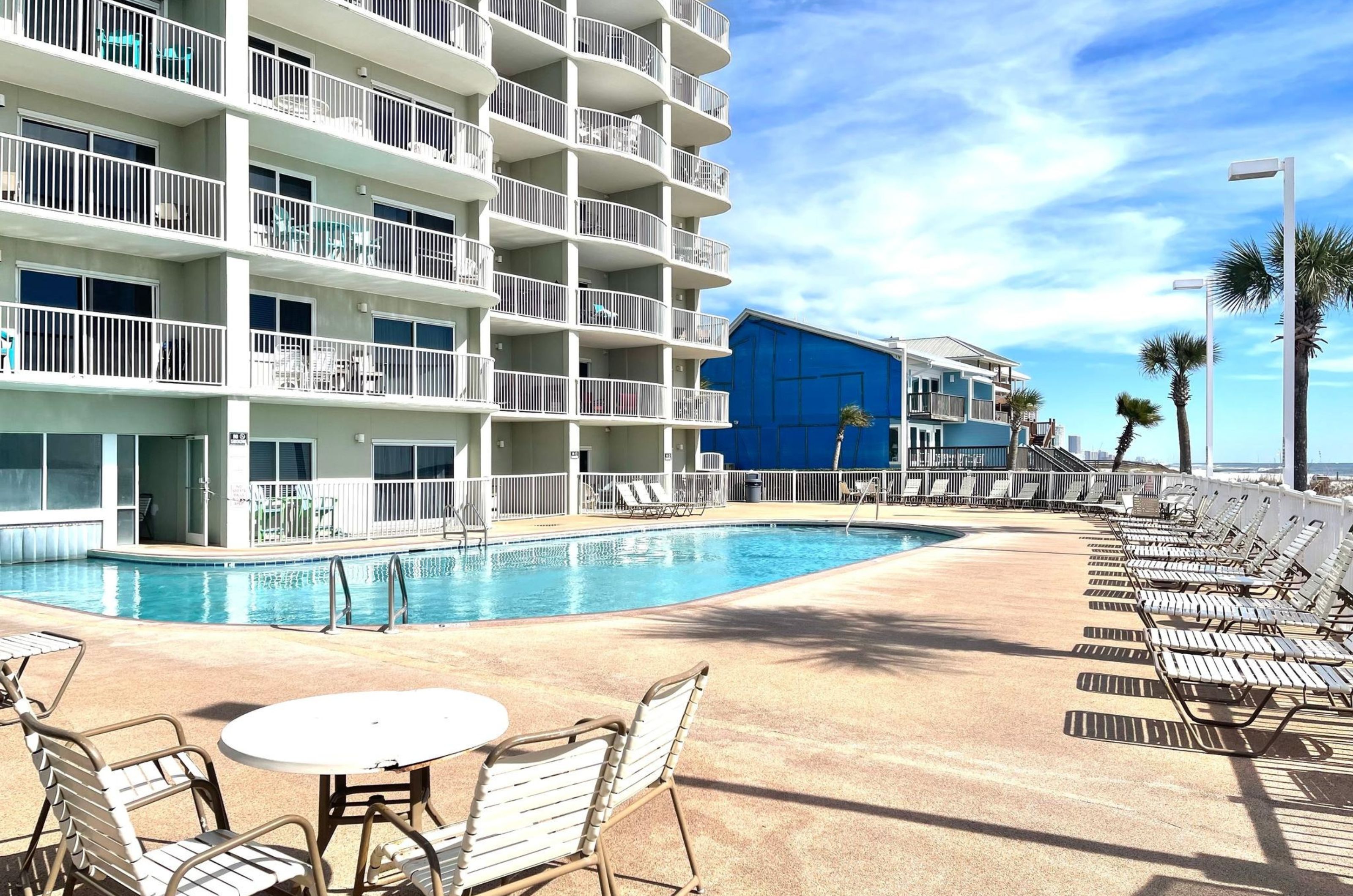 The outdoor swimming pool at Tradewinds Condos