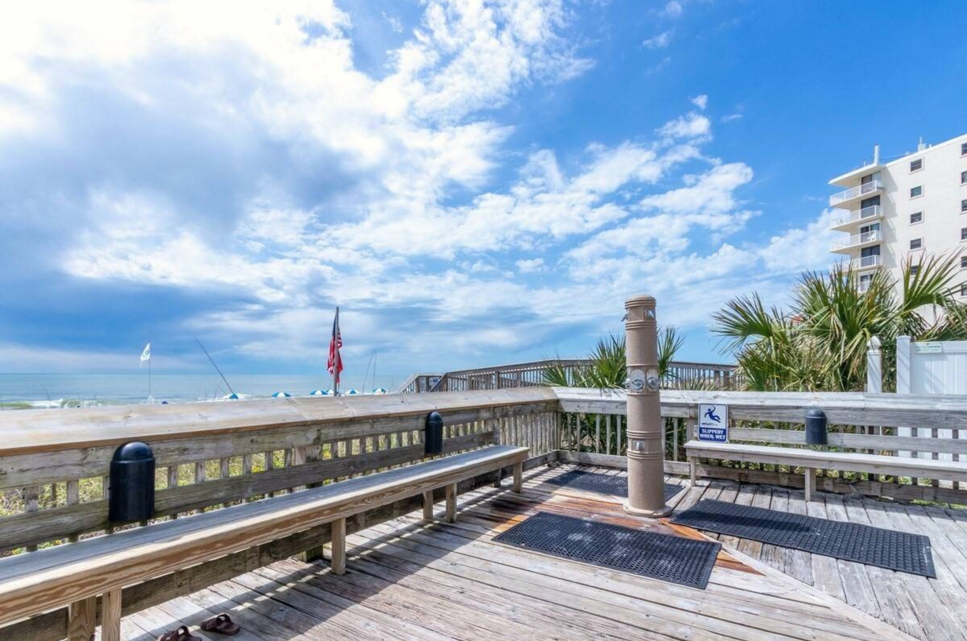 The outdoor showers on the boardwalk at Tradewinds Condominiums