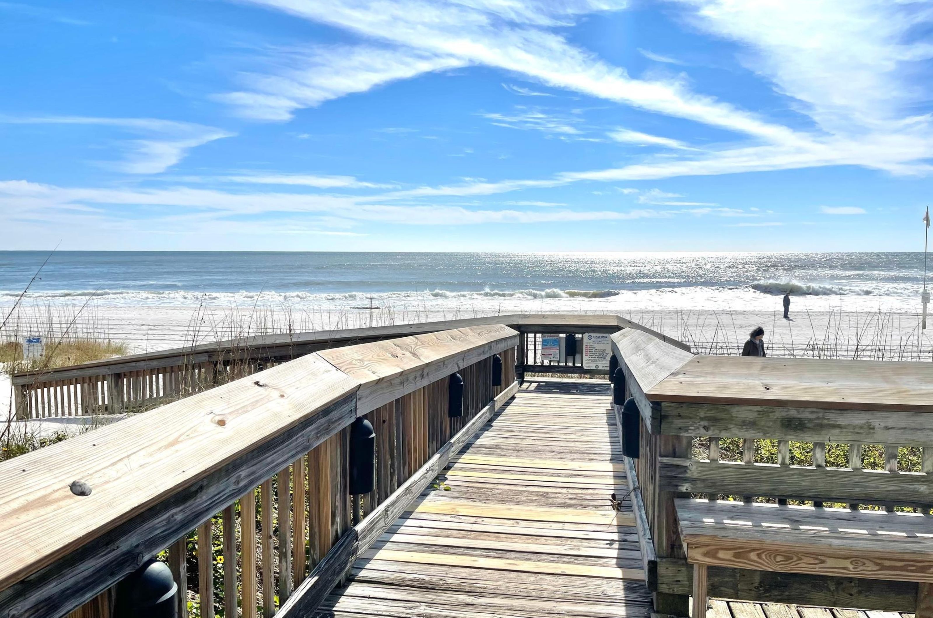 A wooden boardwalk leading to the beach at Tradewinds in Orange Beach Alabama