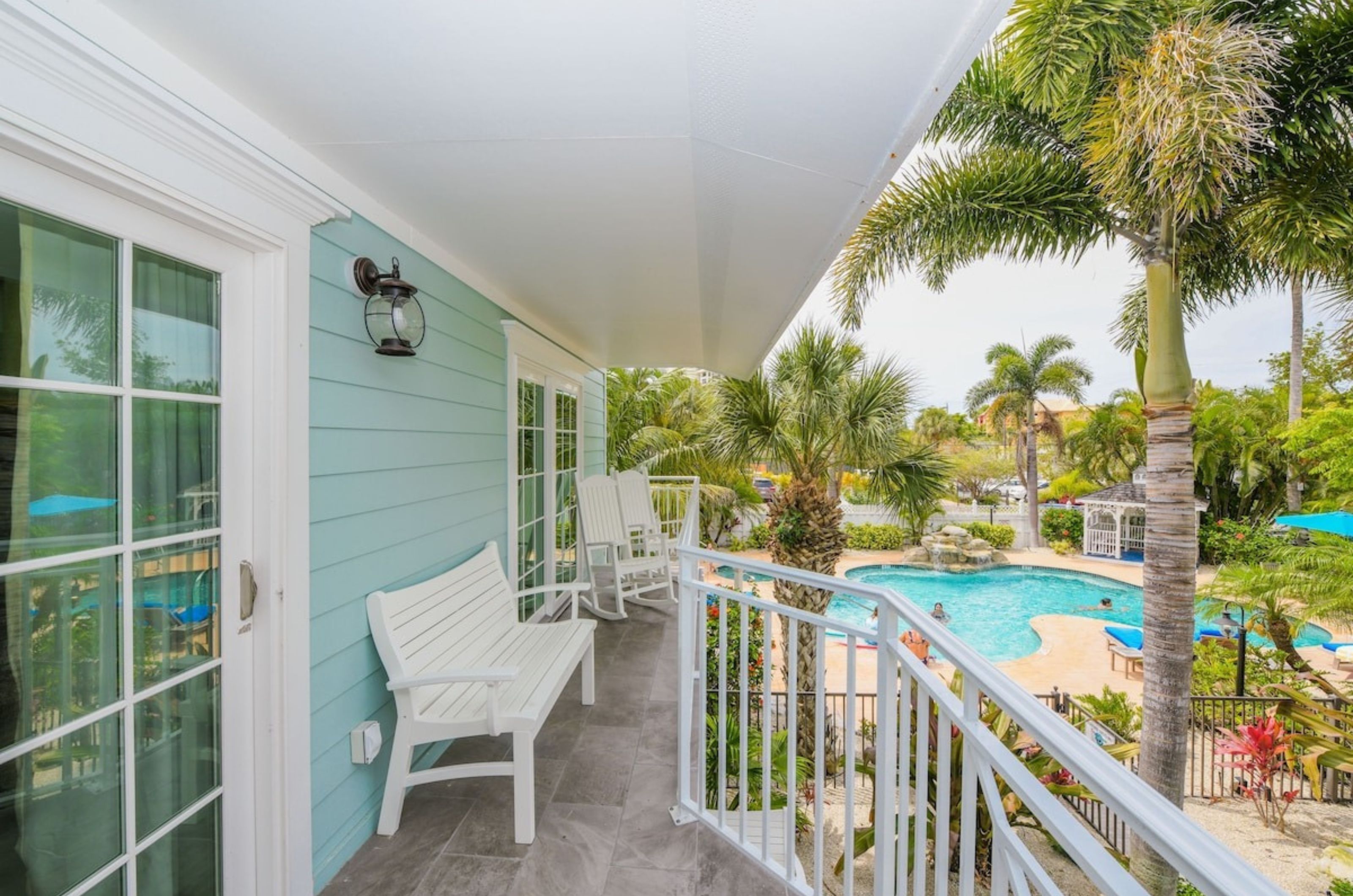 An outdoor terrace with a chair at Tropical Breeze Resort in Siesta Key Florida 