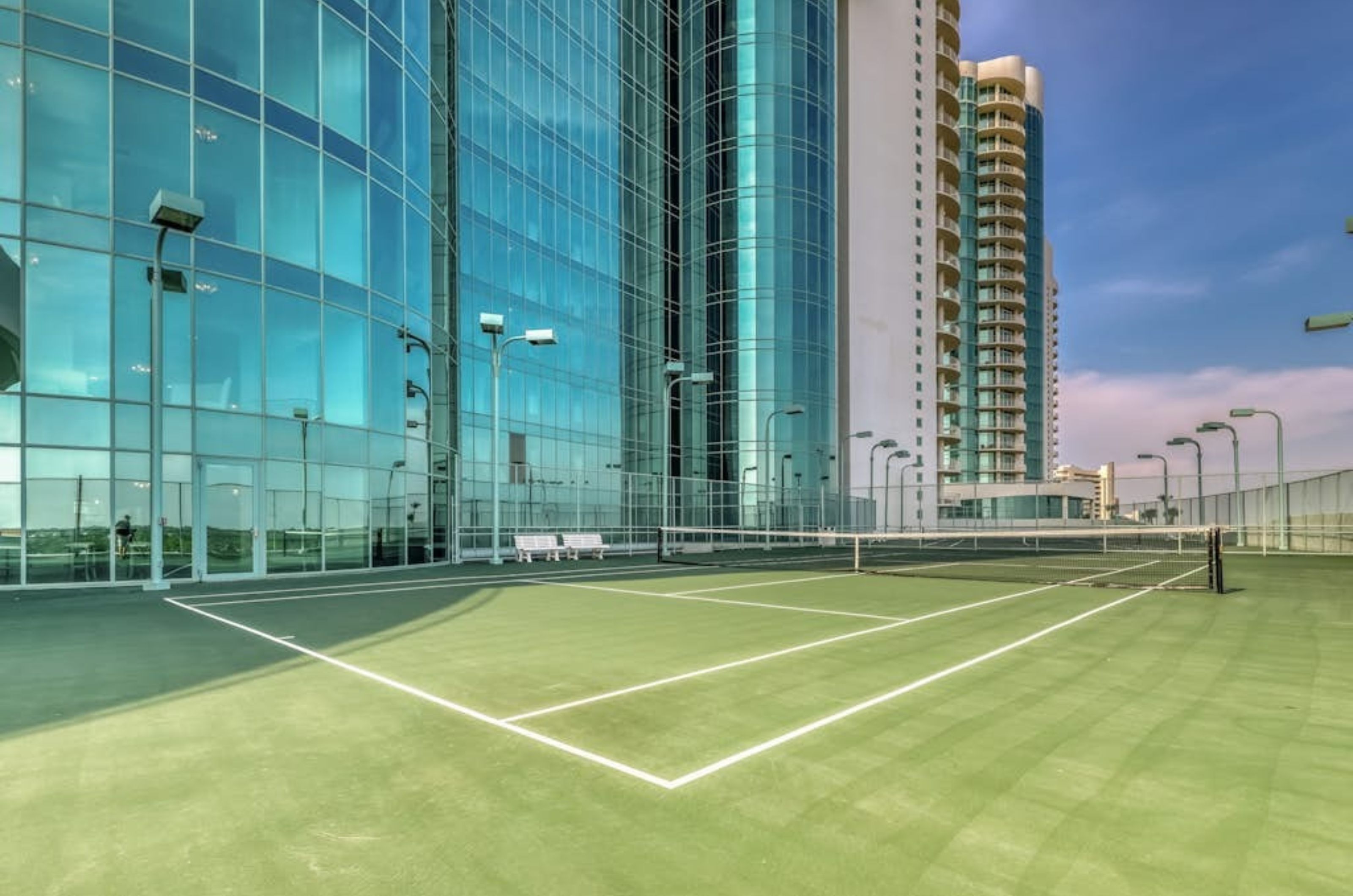 The outdoor tennis court at Turquoise Place in Orange Beach Alabama	