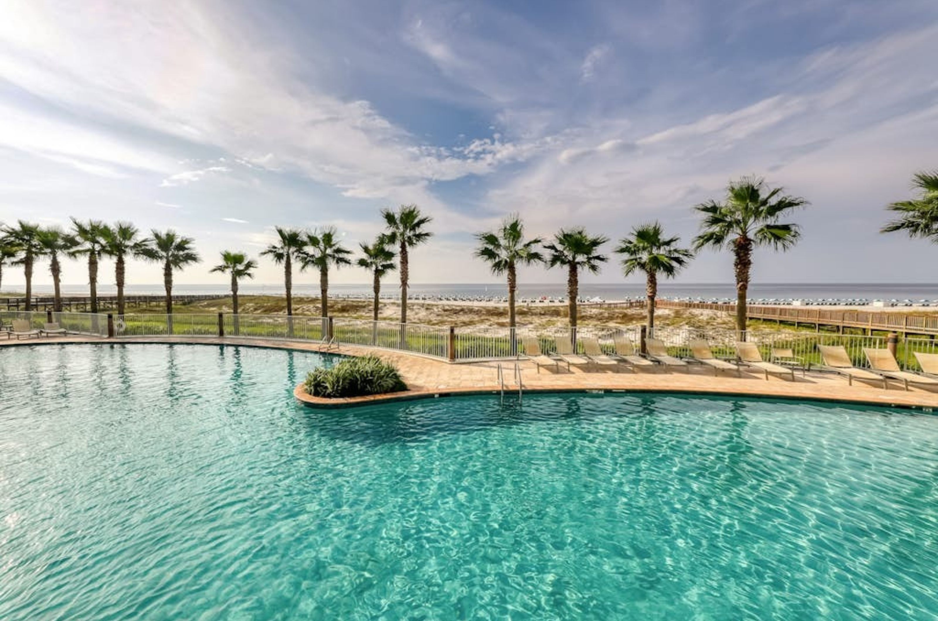 The spacious outdoor pool overlooking the Gulf of Mexico at Turquoise Place 