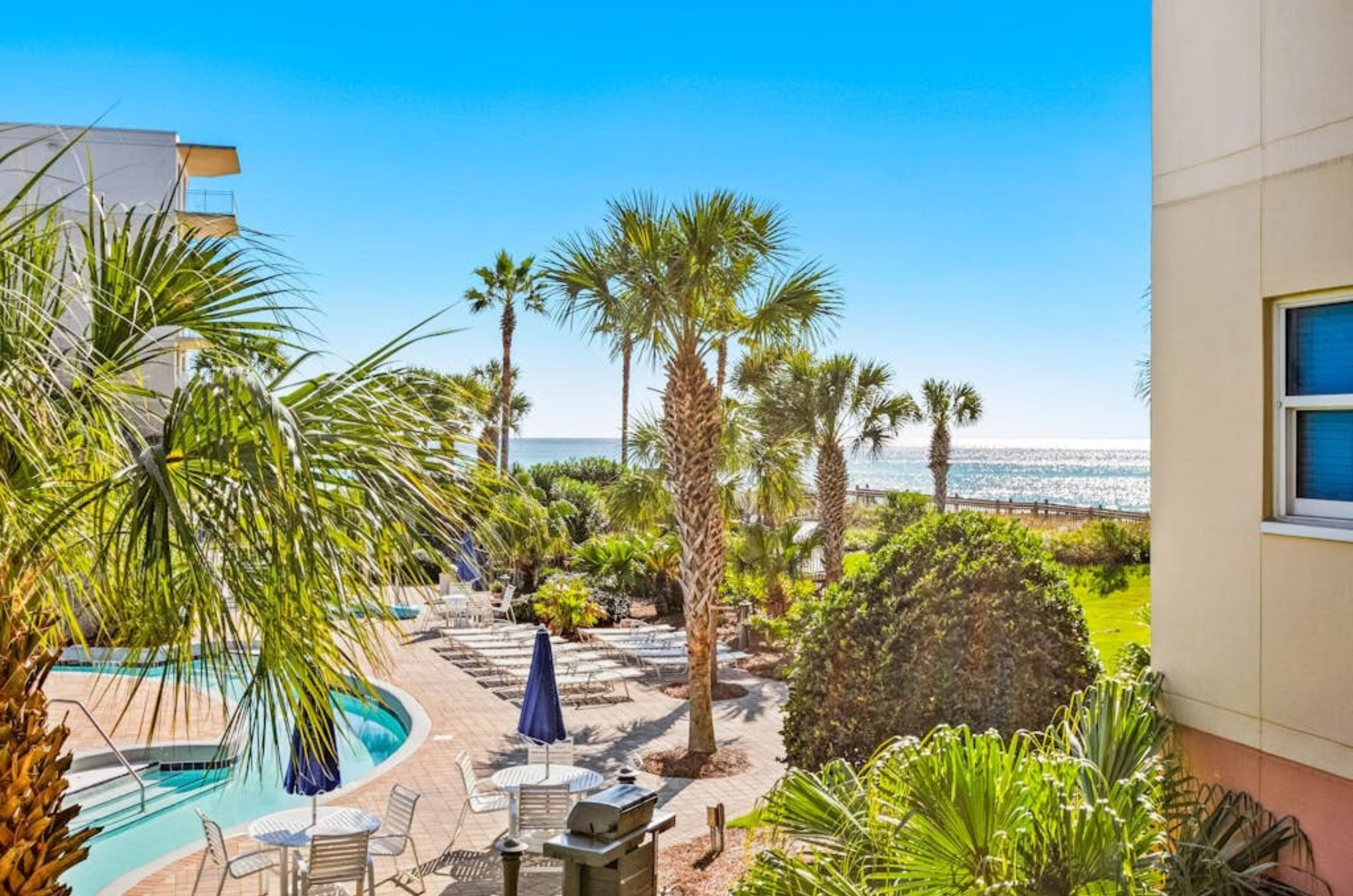 Lounge chairs on the beachside pool deck at Waterscape in Fort Walton Beach Florida 