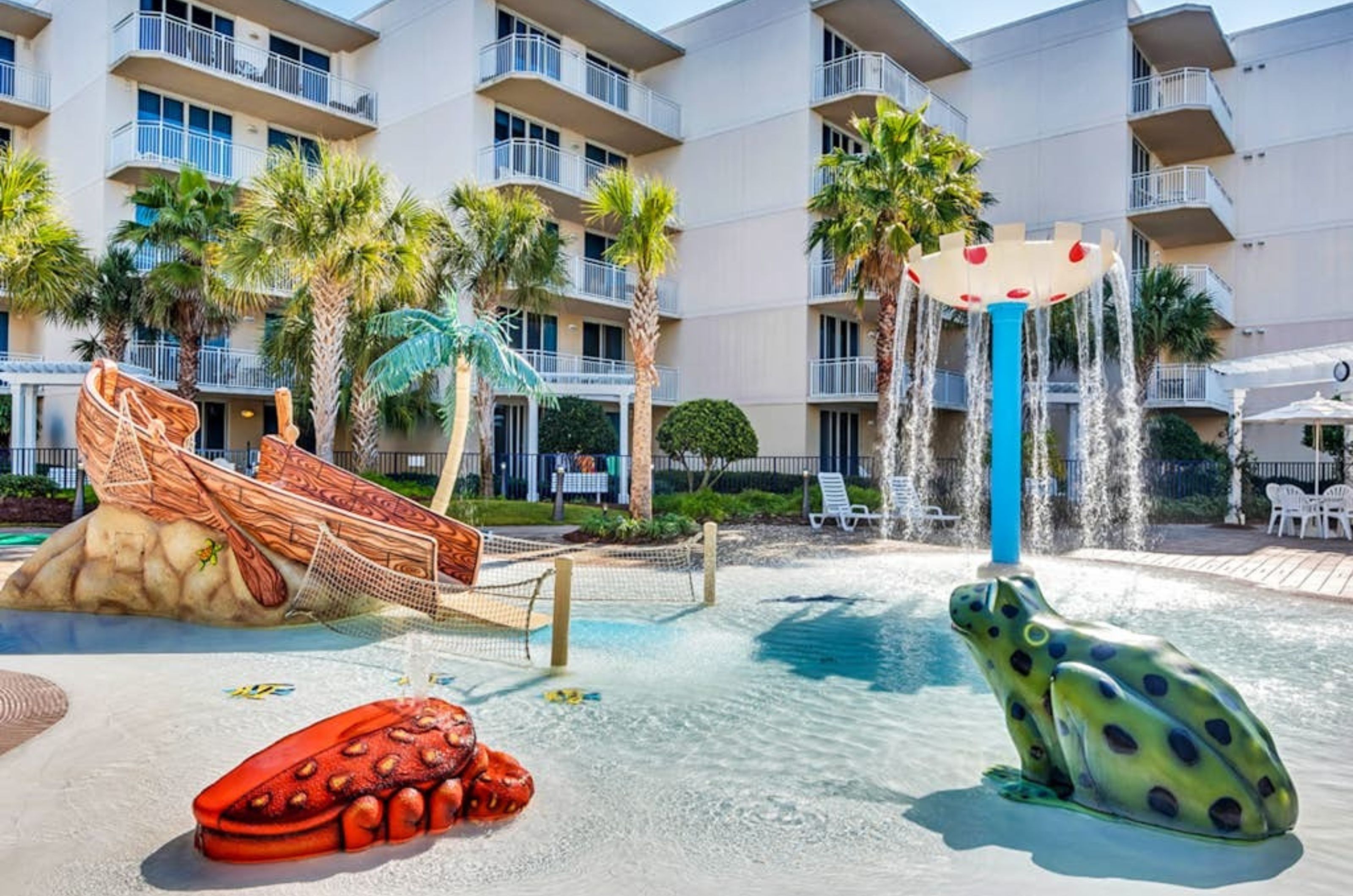 The shallow portion of the swimming pool with water fountain and animal statutes at Waterscape Condominiums  