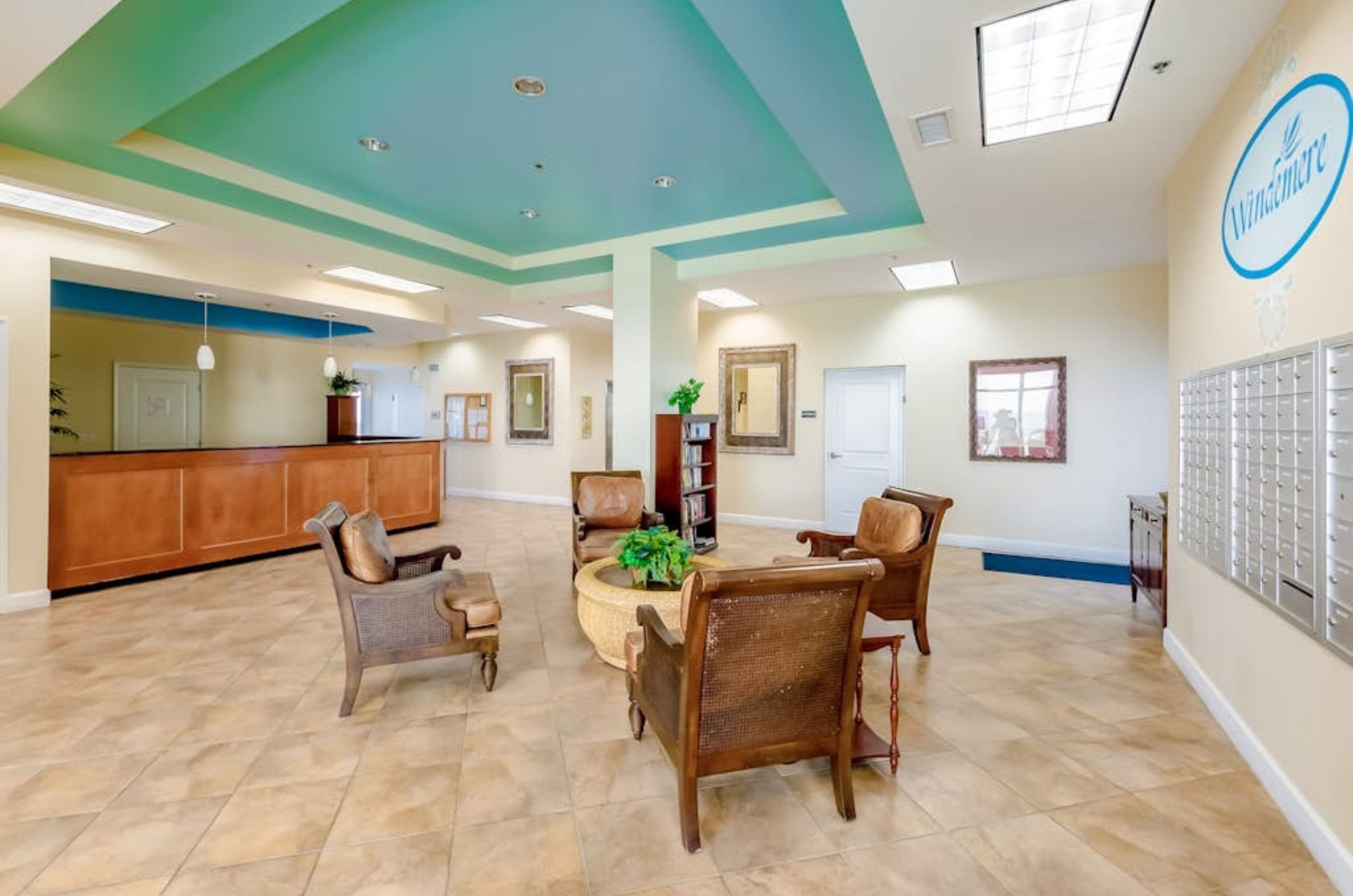 The lobby at Windemere Condo with the welcome desk and chairs