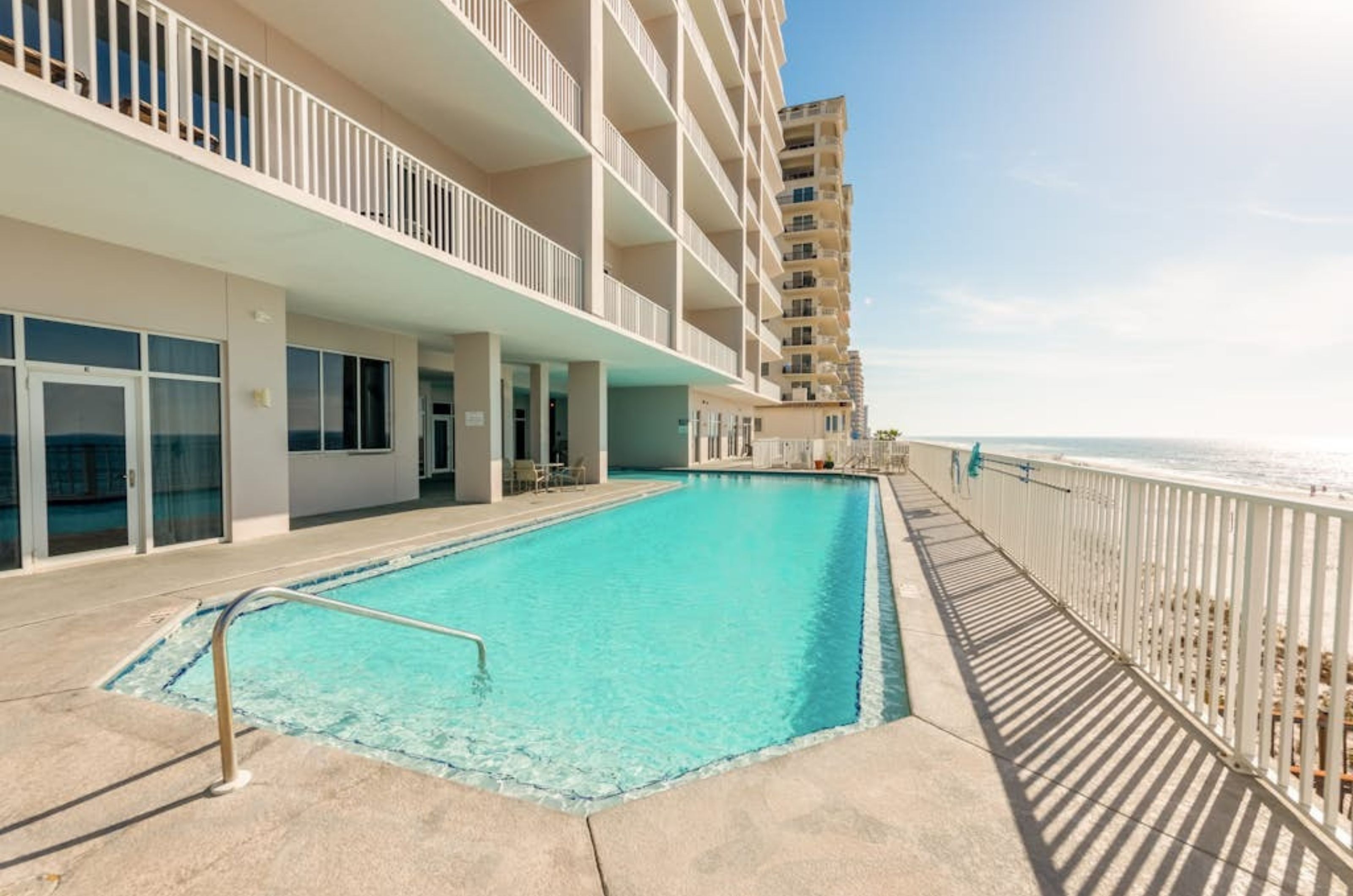 The long outdoor swimming pool in front of Windemere Condominiums in Perdido Key Florida 