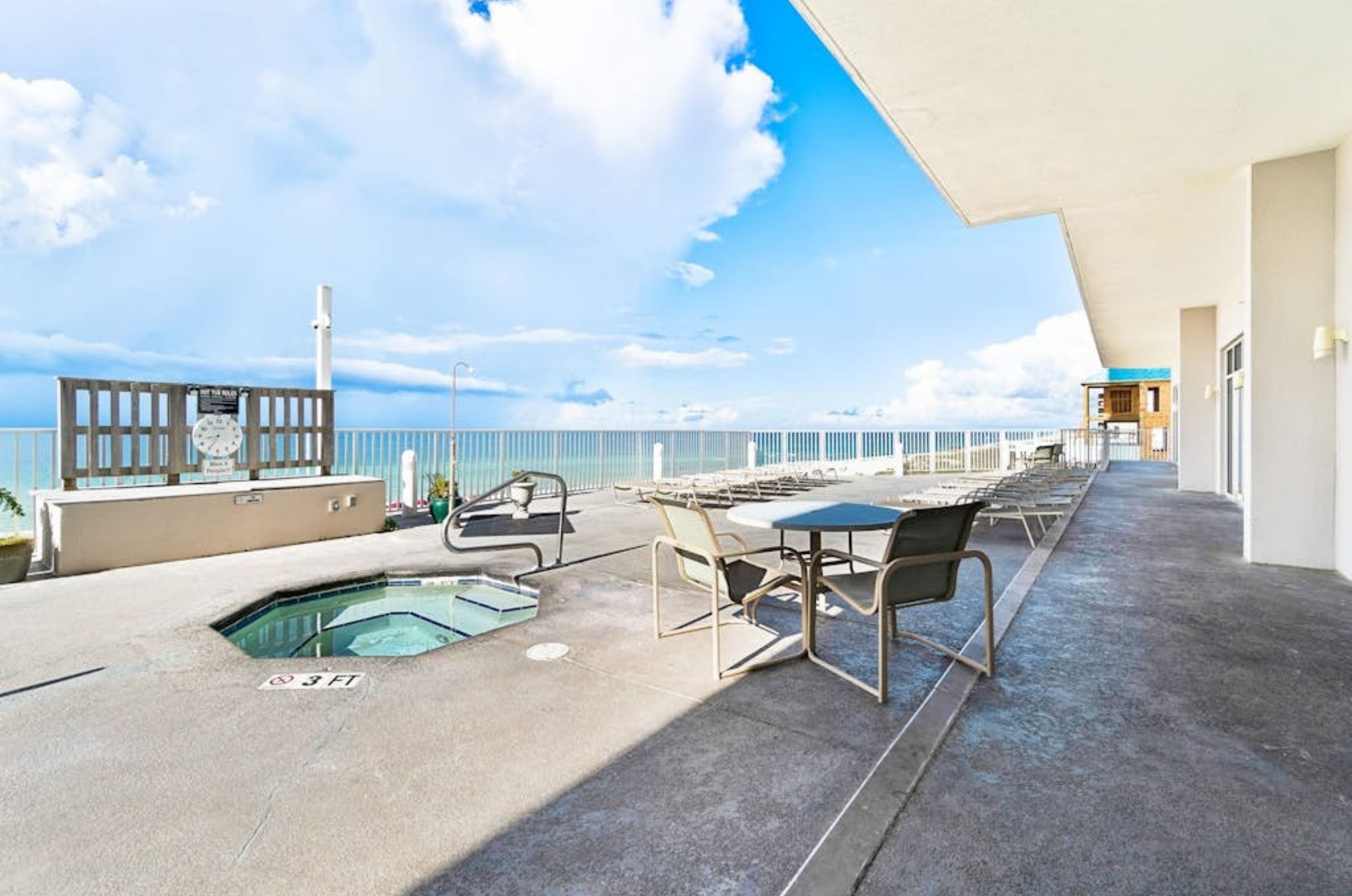 The outdoor hot tub and pool deck at Windemere Condos in Perdido Key Florida 